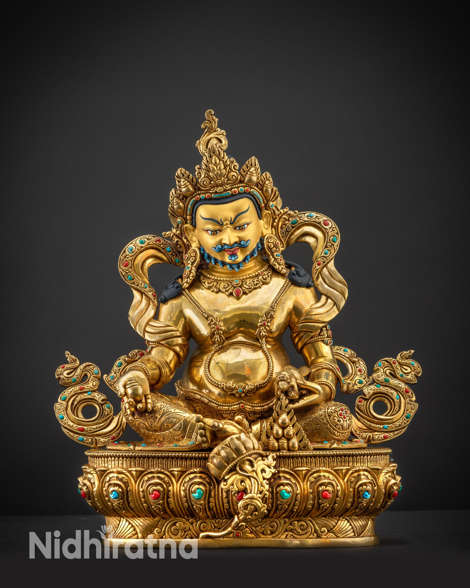 Front view Dzambhala statue with gold-gilded face and fire-gilded body on copper alloyy