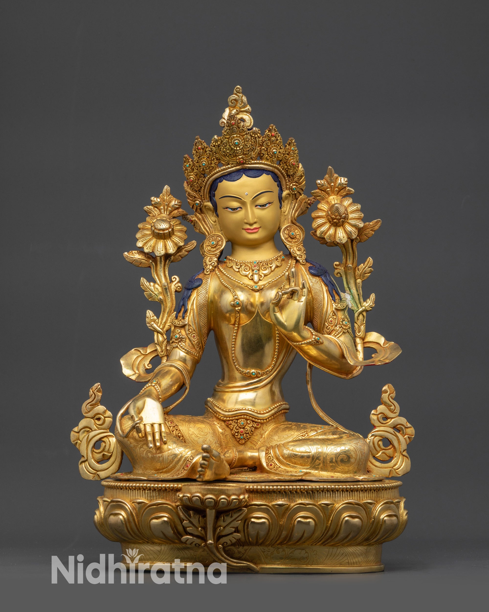 Front view Green Tara Goddess statue with gold-gilded face and lotus seat