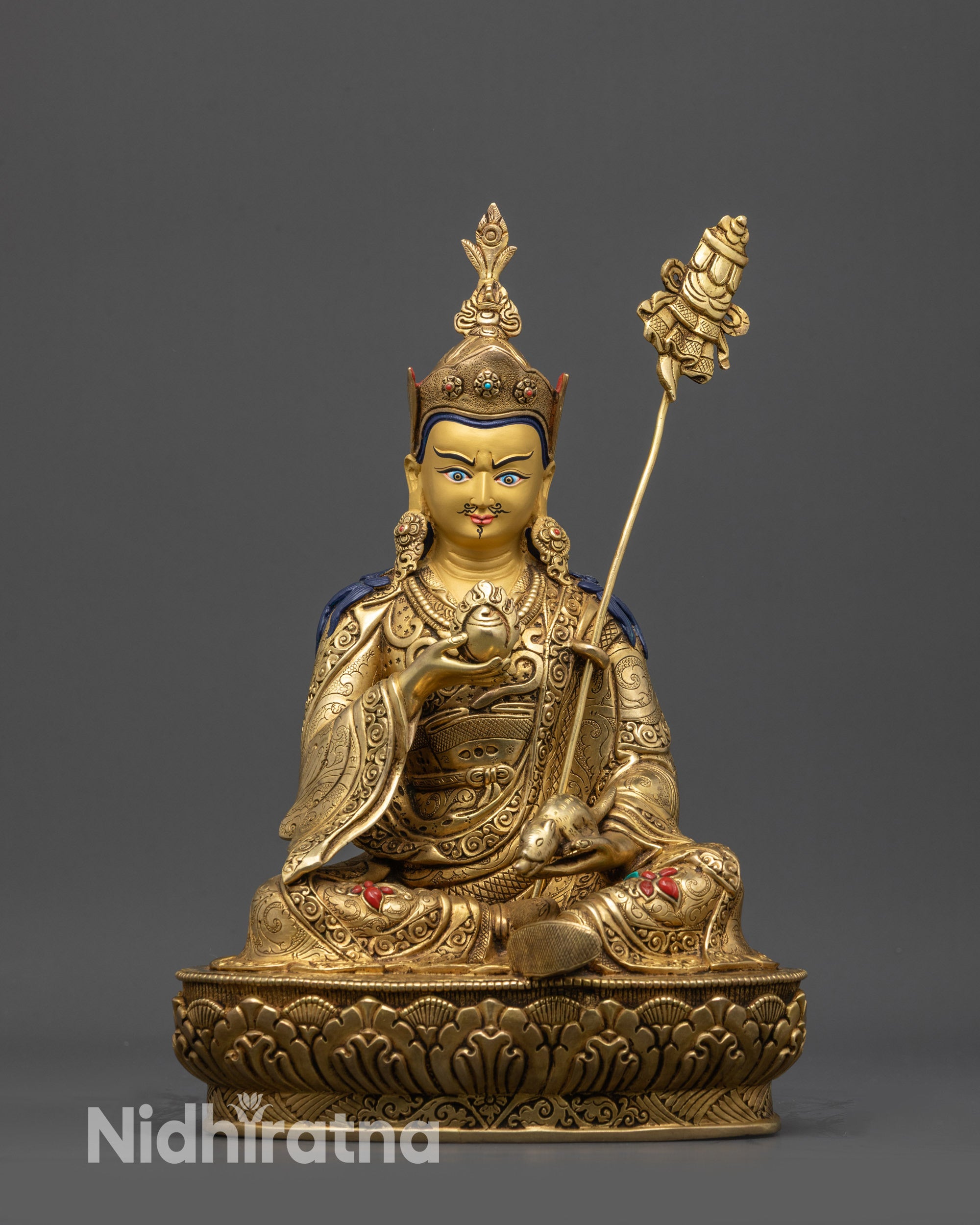Front view Guru Norlha statue with gold-gilded face, lotus seat, and Nepal artisan details