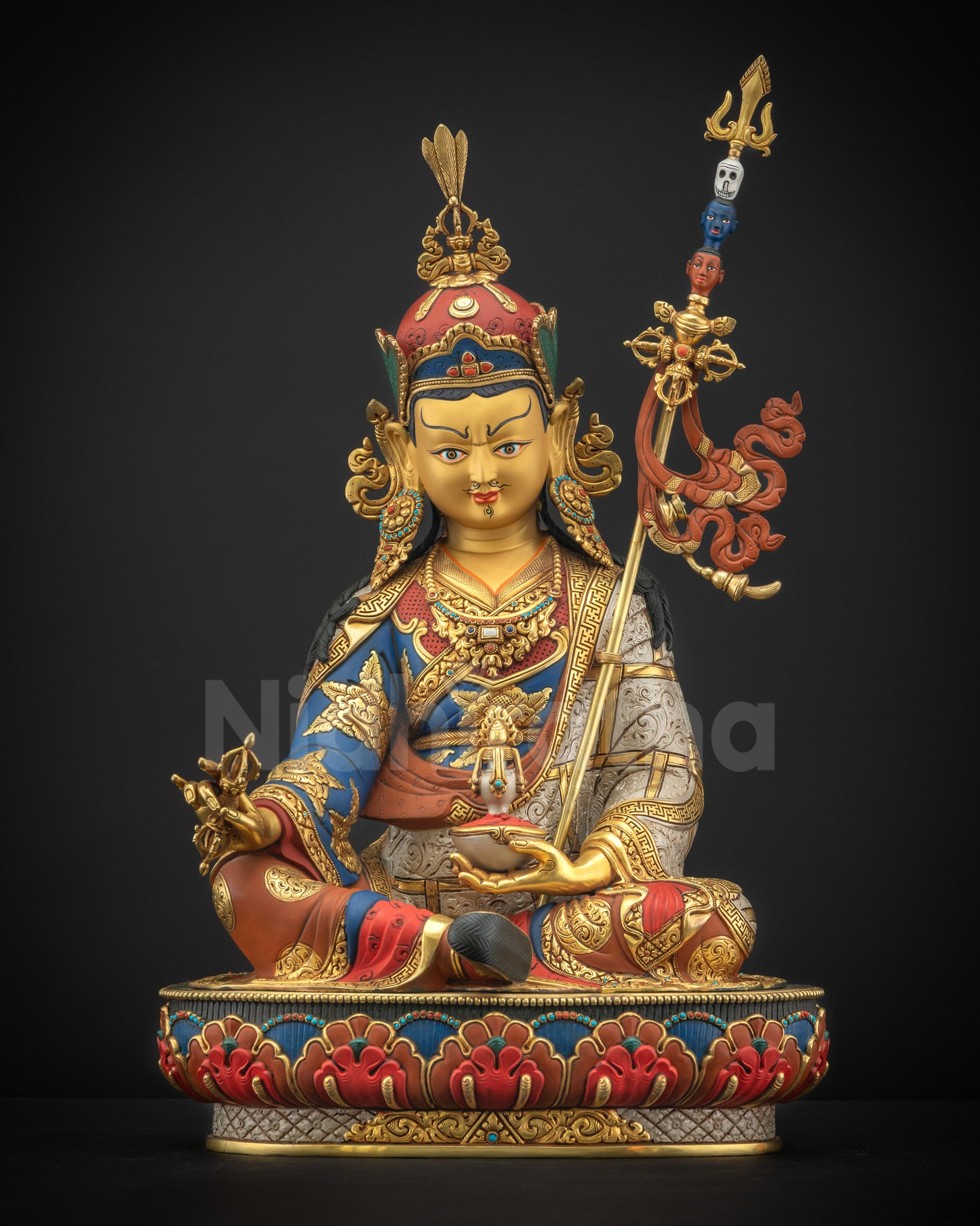 Front view Guru Rinpoche statue showing semi-wrathful expression and sacred iconography