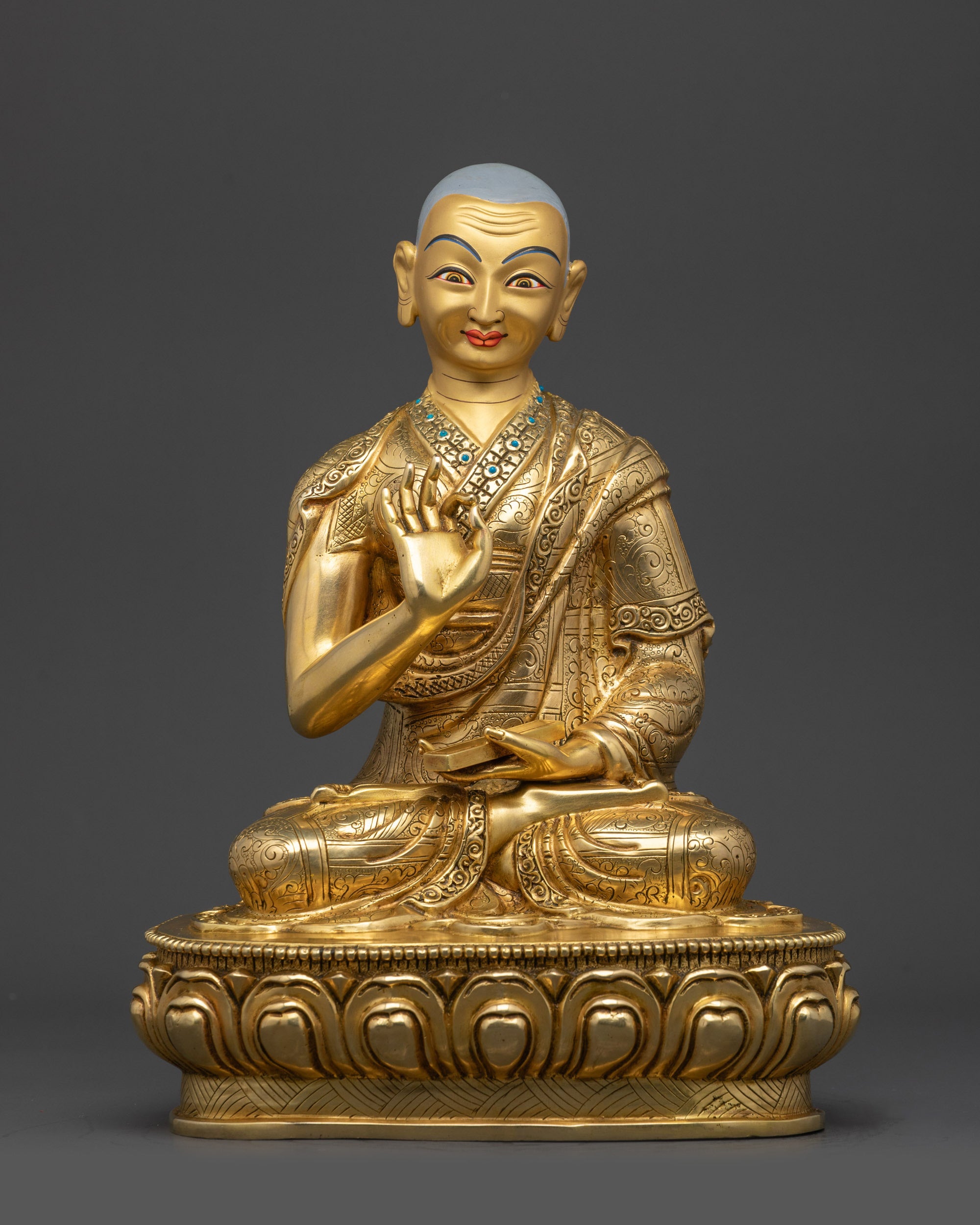 Front view Gyaltsab Je disciple statue with Vitarka Mudra holding scripture