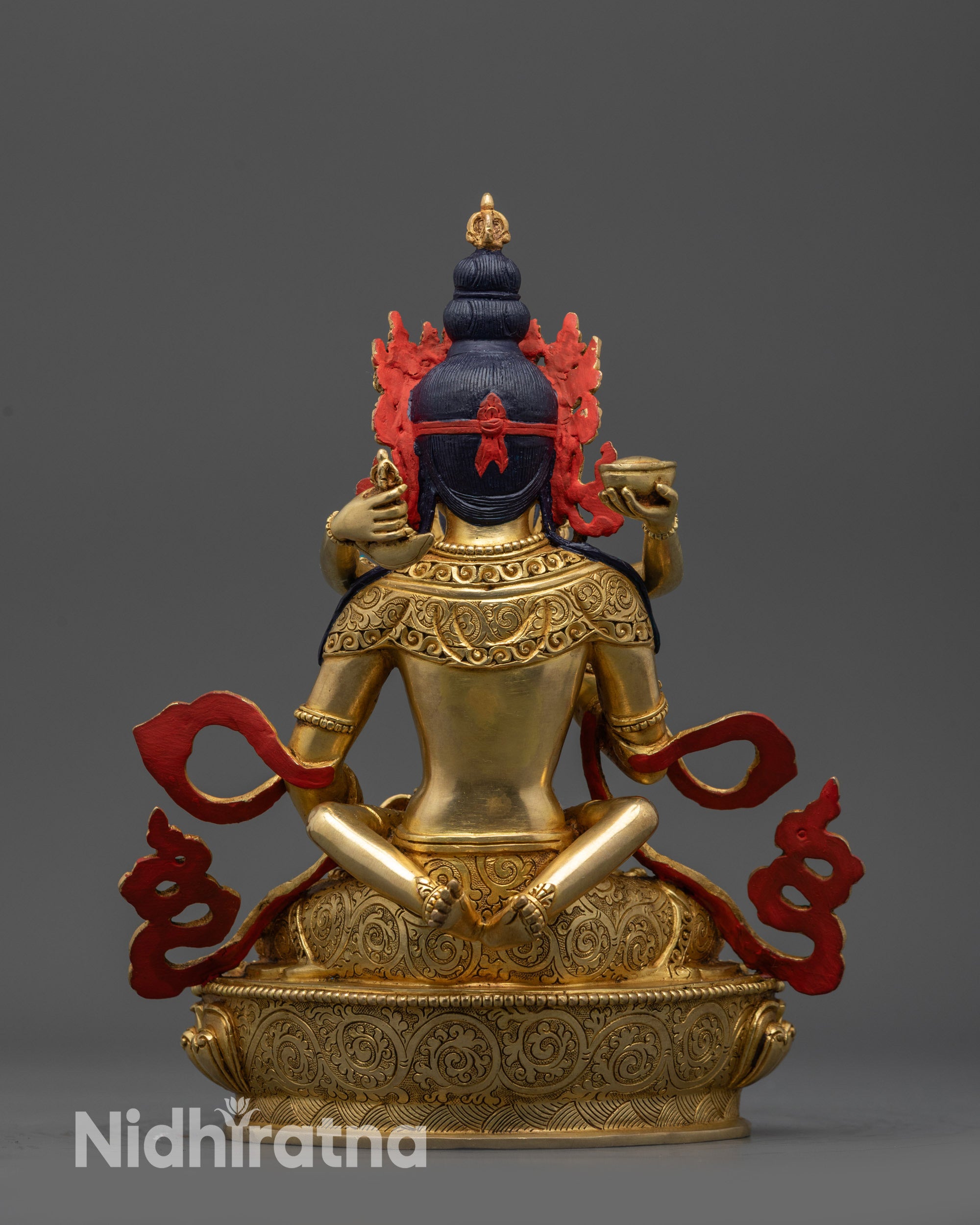 Front view Handmade Dorje Sempa Statue gold-fire gilded Buddhist altar artwork
Close up Dorje Sempa Vajrasattva statue showing five-jeweled crown and intricate patterns
Side view Dorje Sempa statue with swirling robe and detailed lotus seat for meditation
Back view Dorje Sempa statue copper base with gold-fire gilded body and carved patterns
