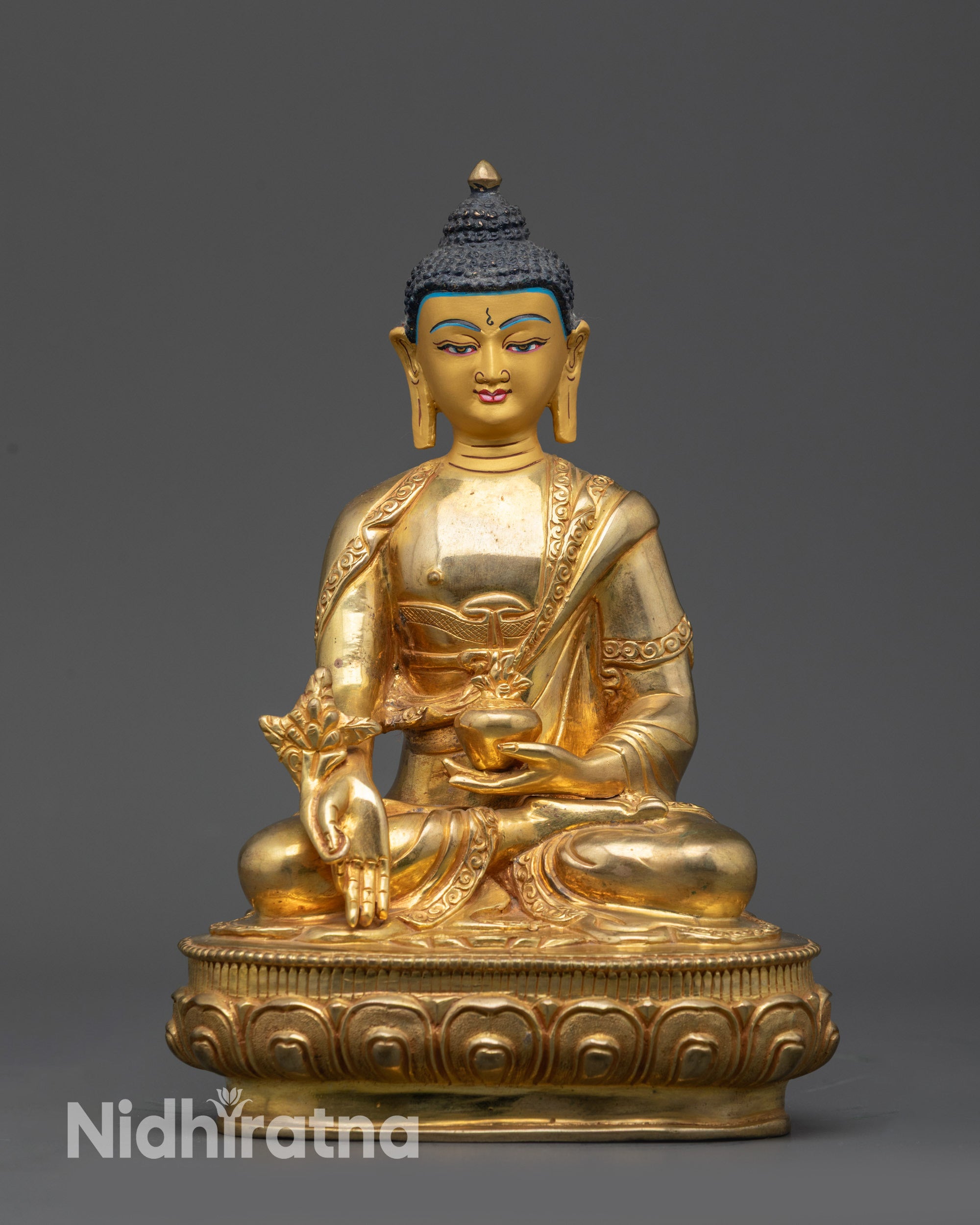 Front view Himalayan Medicine Buddha statue with gold-gilded face and copper alloy details