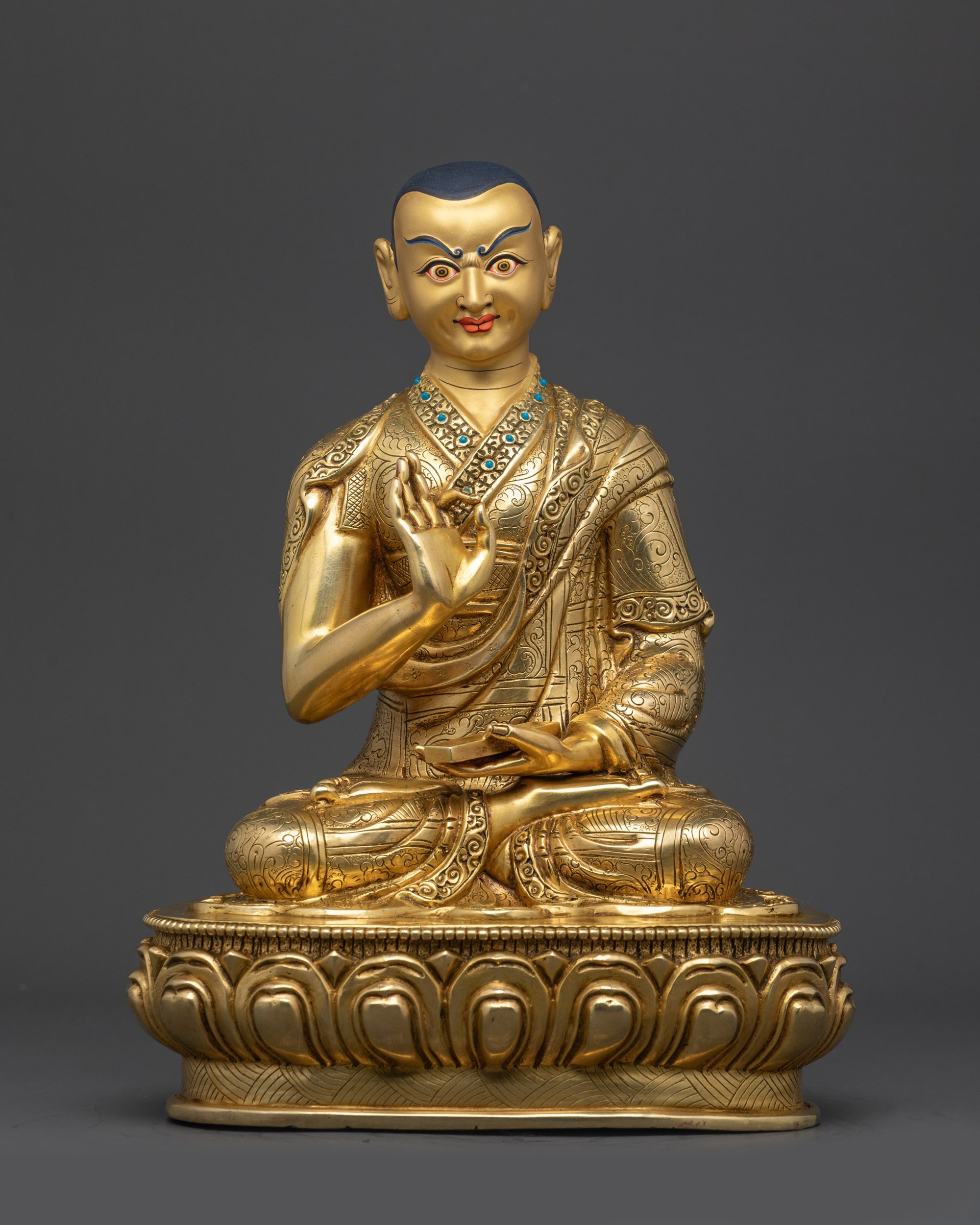 Front view Khedrup Je disciple statue with Vitarka Mudra holding scripture