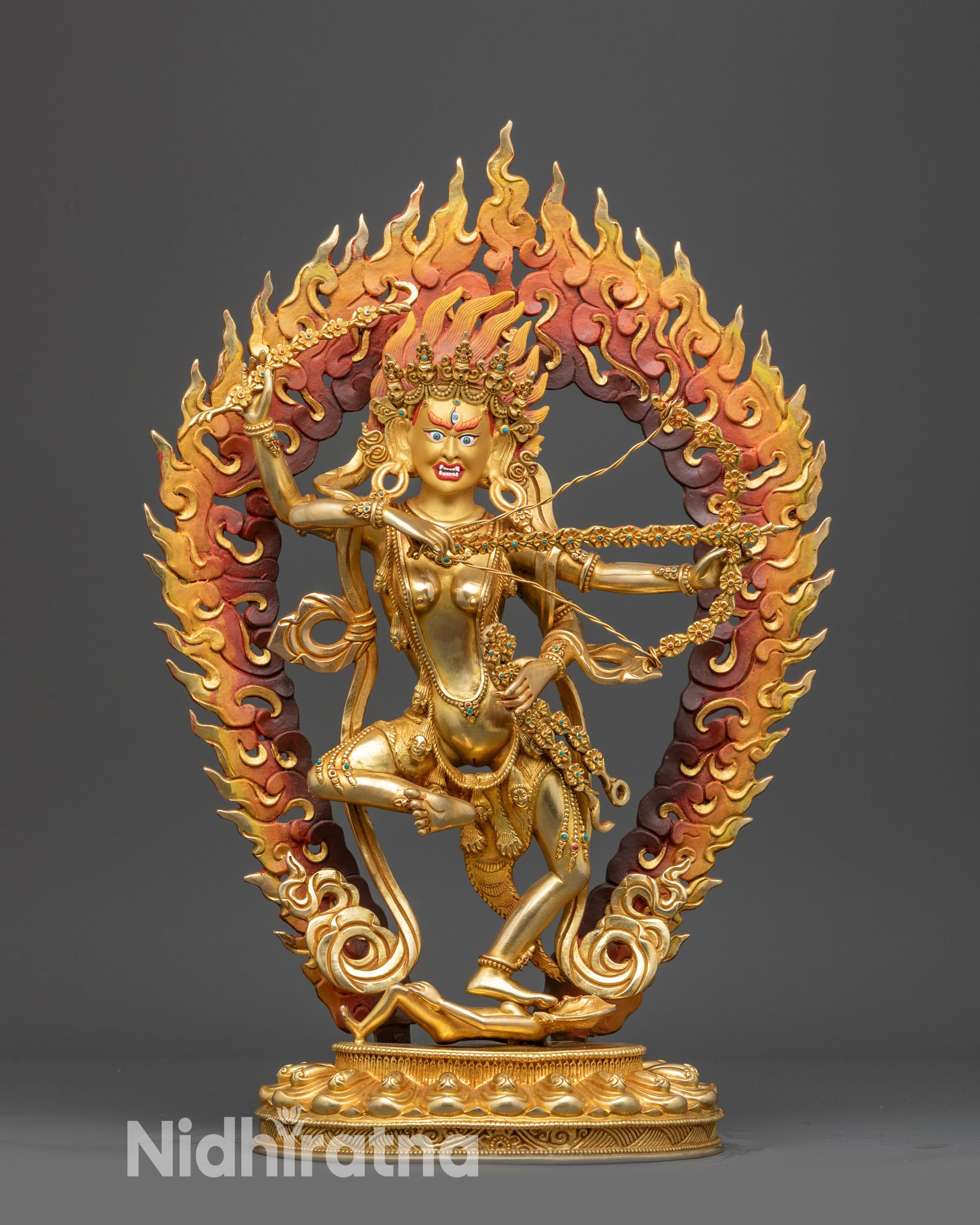 Front view Kurukulla statue with gold-gilded face, five-skull crown, and fire-gilded body