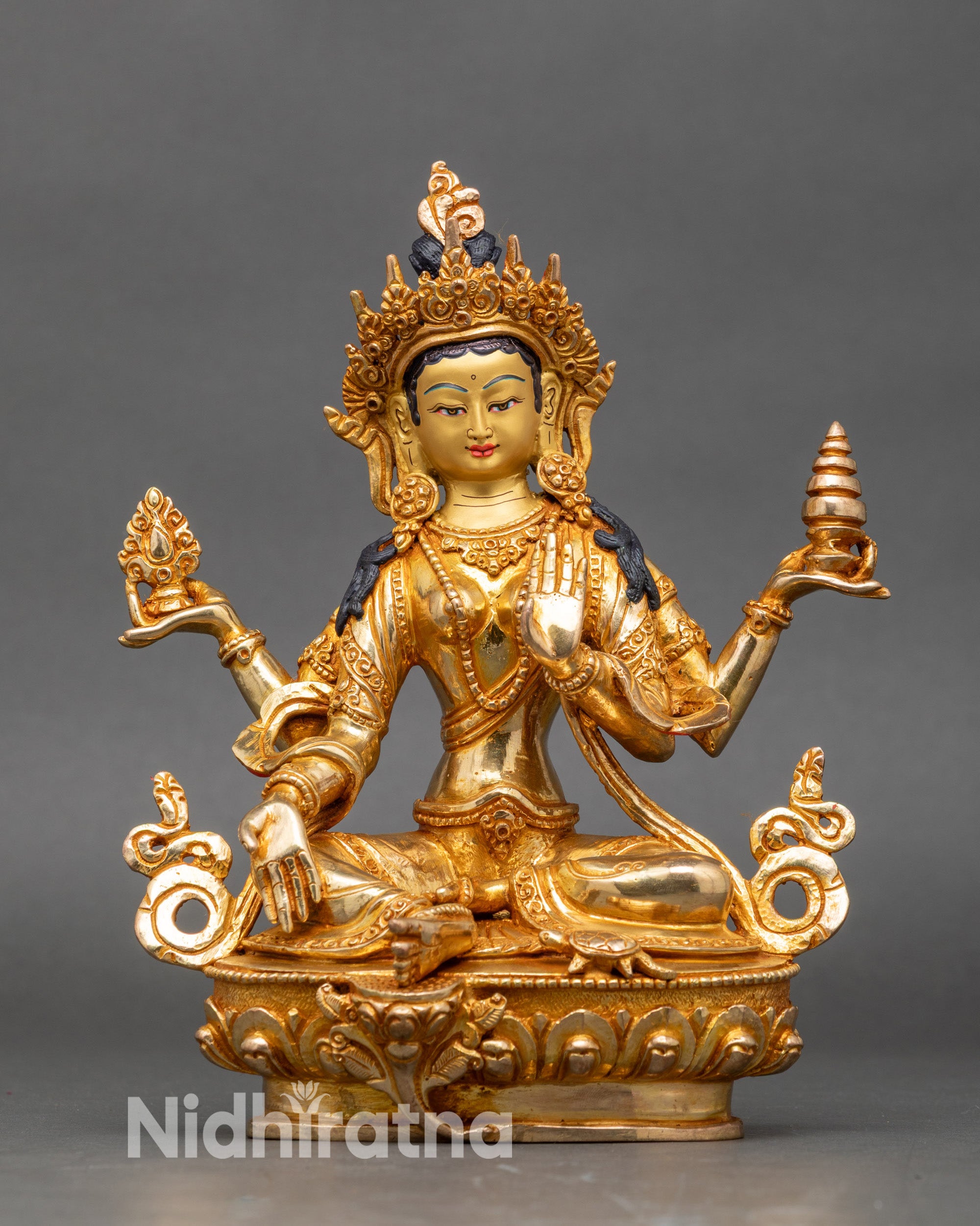 Front view Lakshmi statue copper with gold-gilded face and intricate carvings