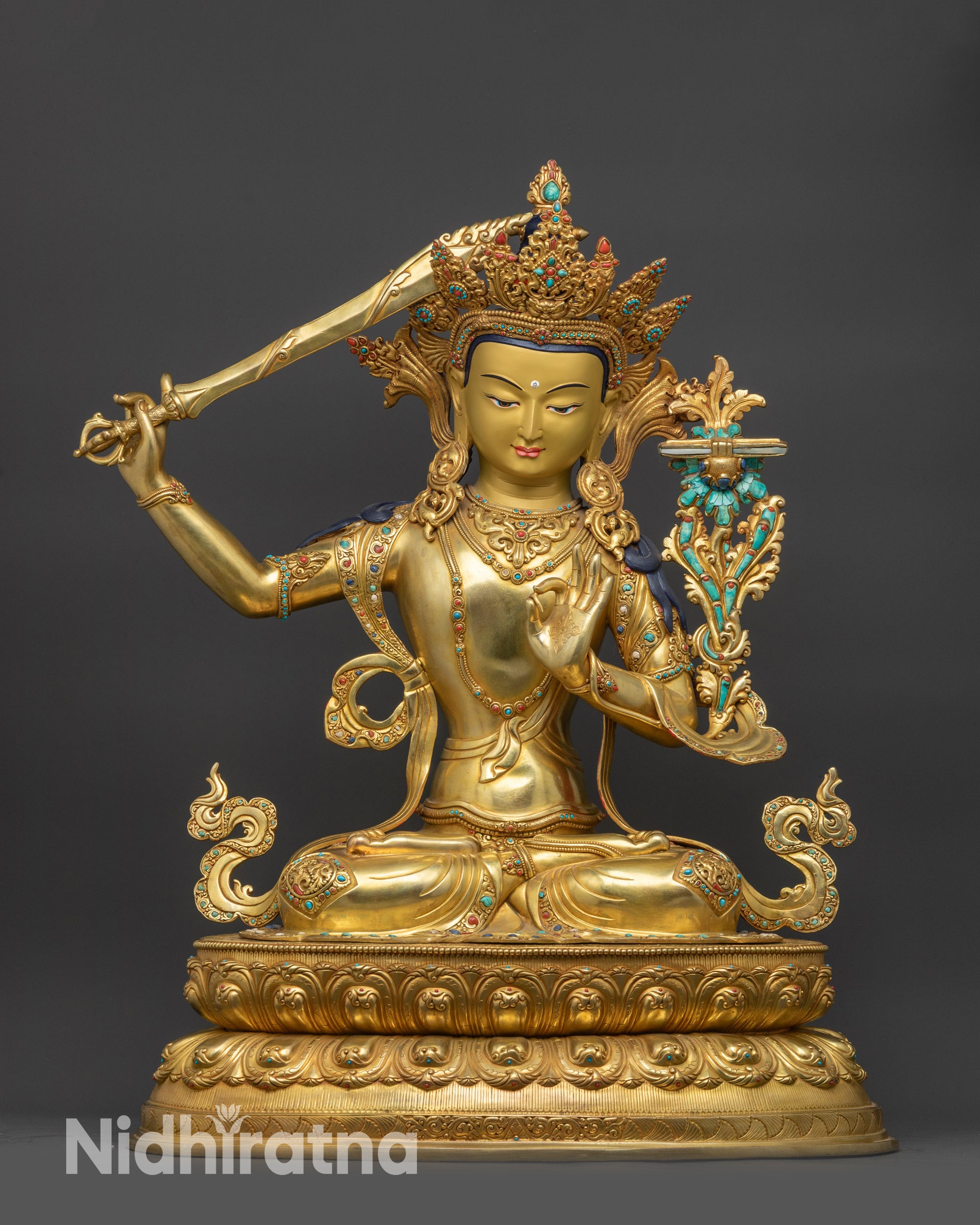 Front view Manjushri Sculpture on lotus seat with gold-gilded face and crown