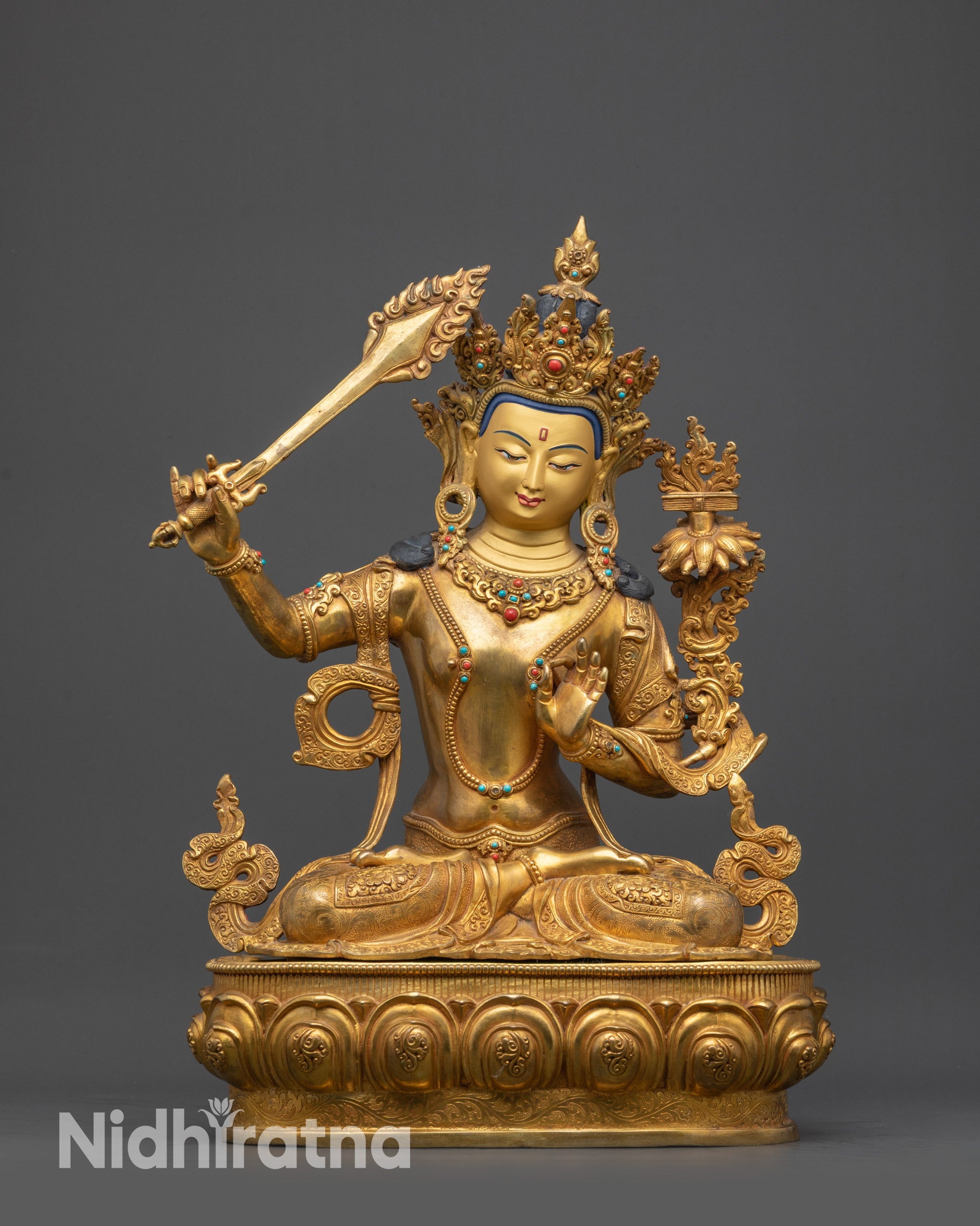 Front view Manjushri Statue with gold-gilded face and lotus seat carvings