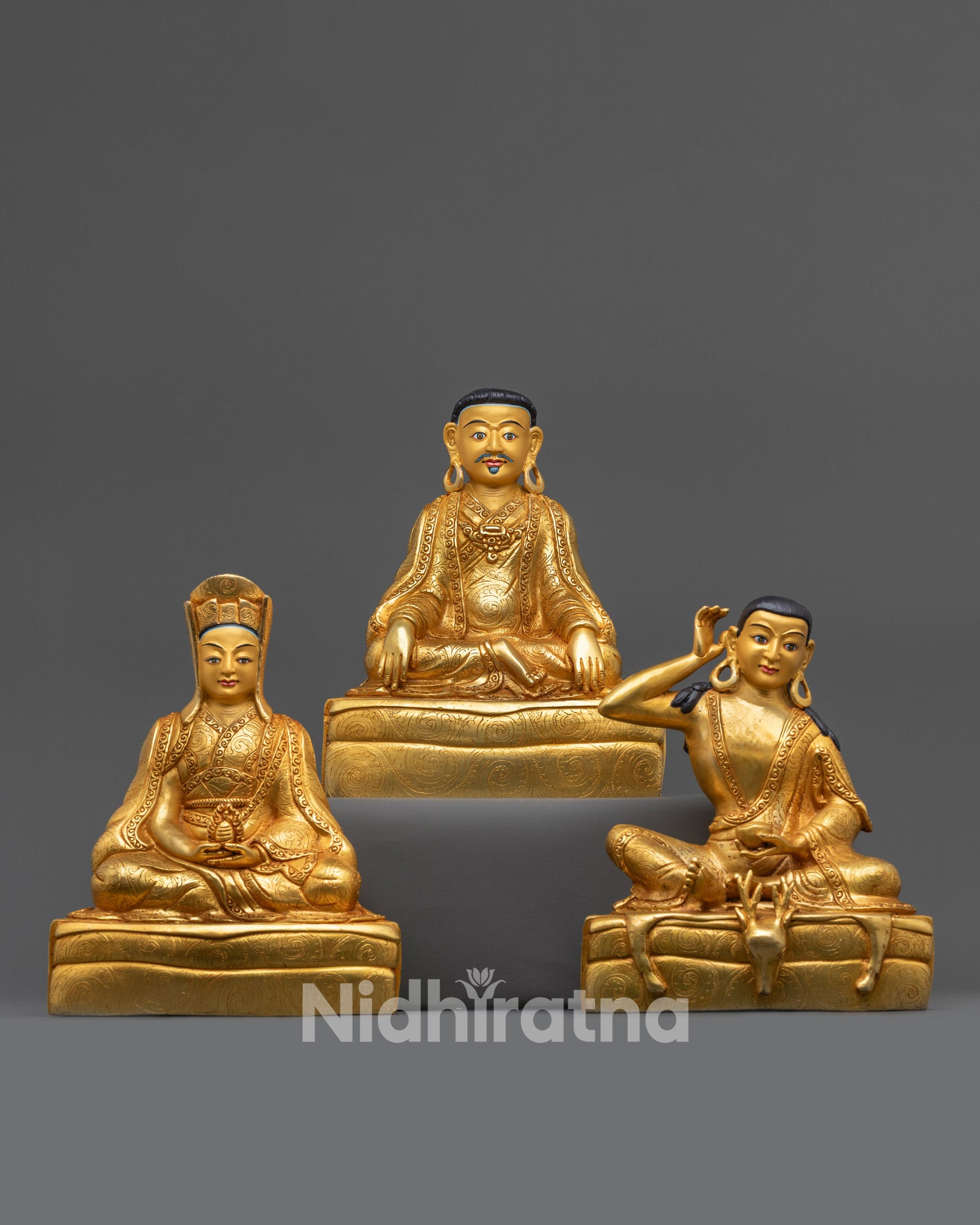 Front view Marpha Set statues with 24K gold-gilded faces and fire-gilded copper bodies