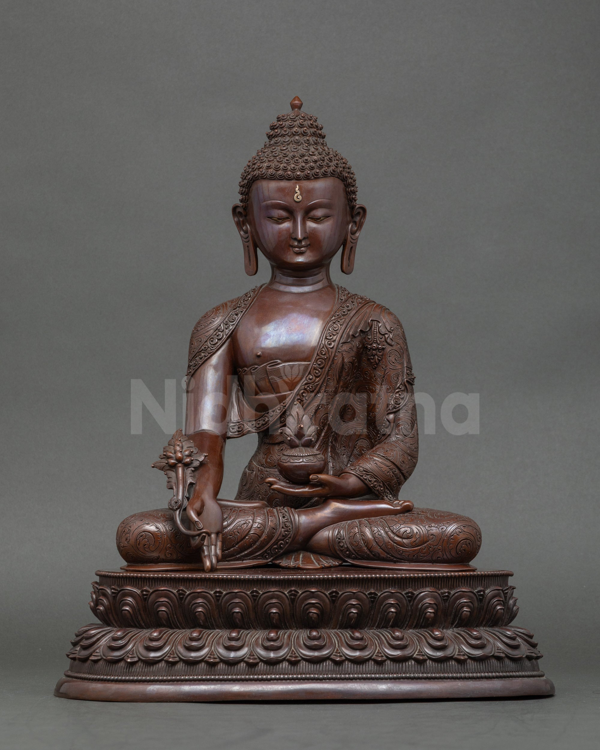 Front view Nepalese Medicine Buddha statue on double lotus throne, copper oxidized finish