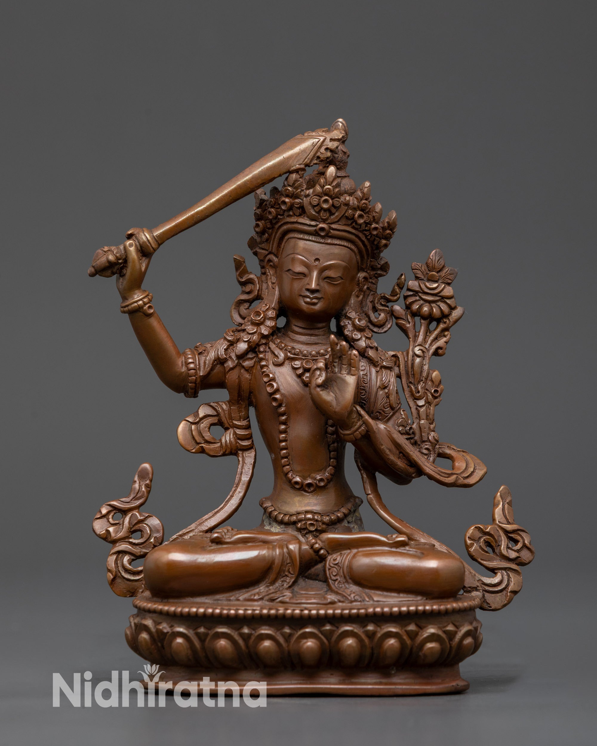Front view Nepalese Oxidized Manjushri Statue holding sword and utpala flower