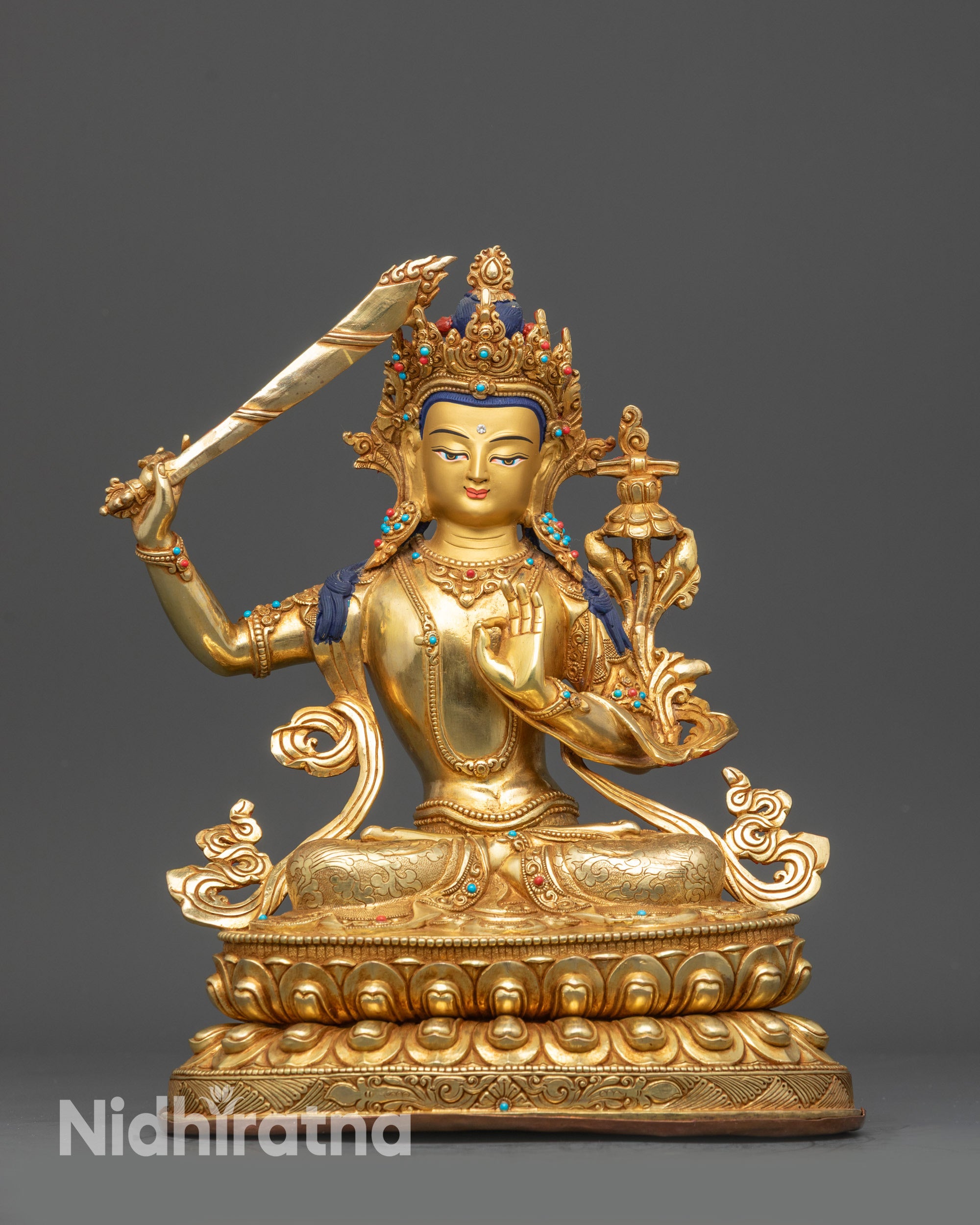 Front view Prince of Wisdom Manjushree statue with gold-gilded face and lotus seat