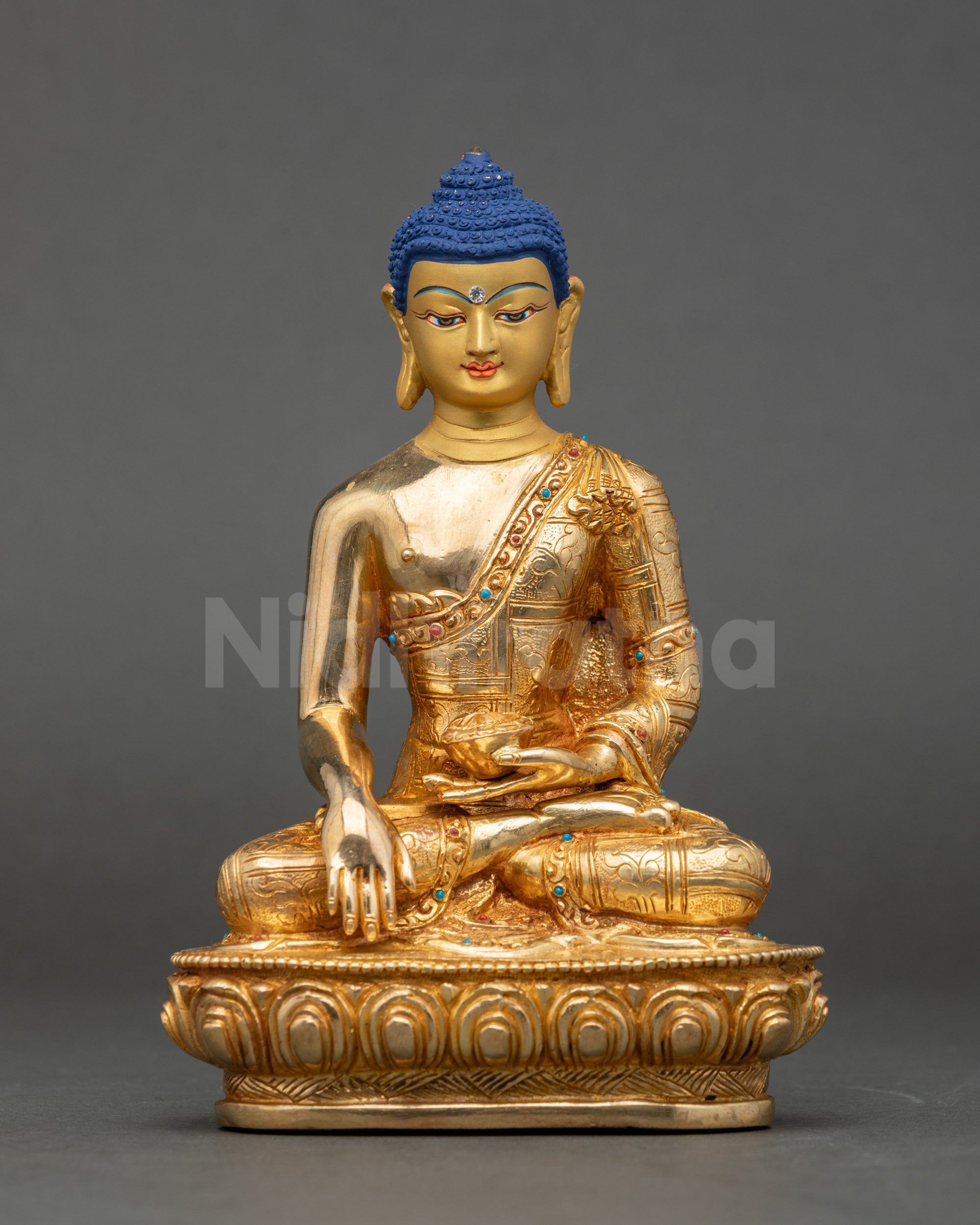 Front view Shakyamuni Buddha statue gold-detailed copper with Bhumisparsha mudra