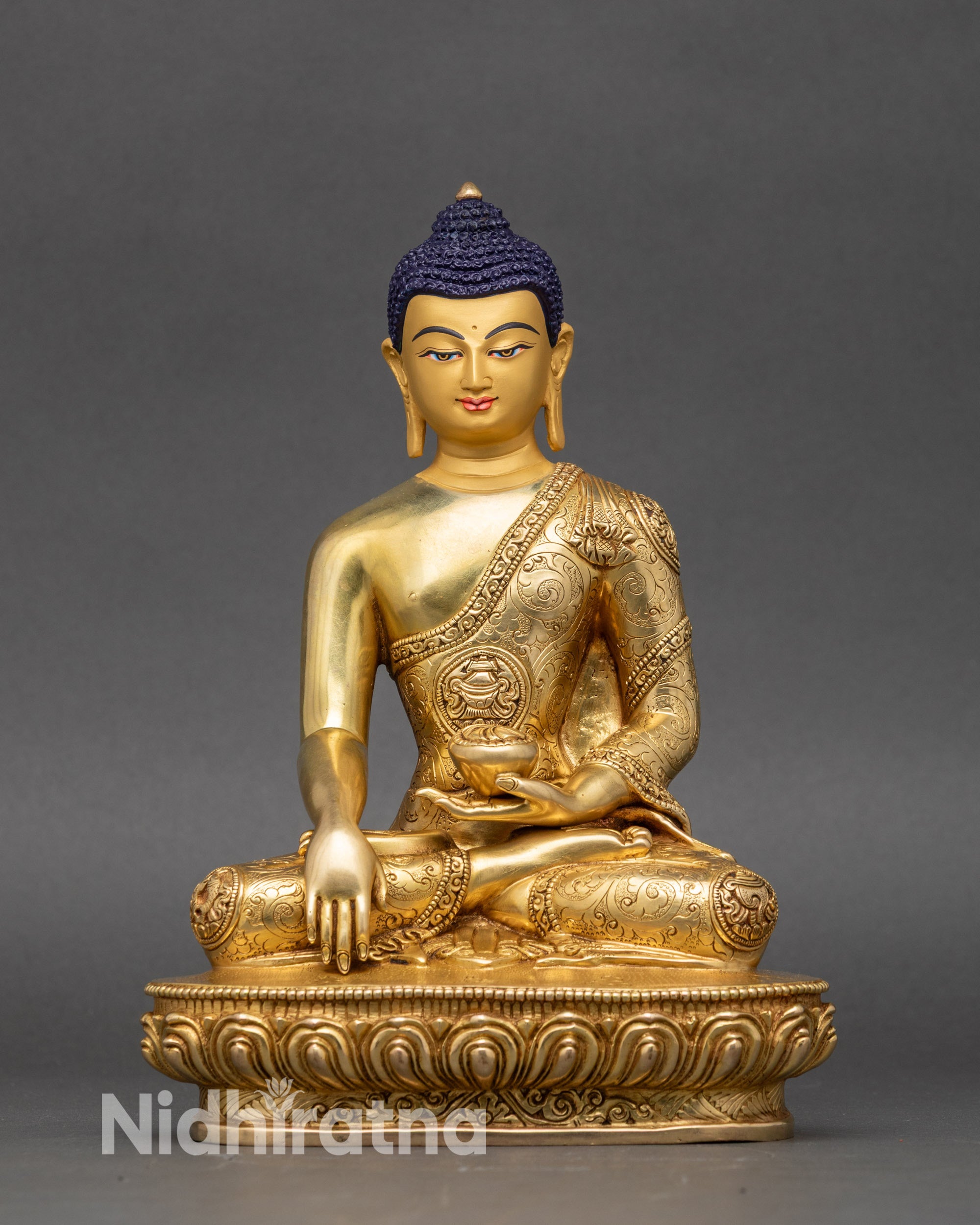 Front view Shakyamuni Buddha statue gold-painted face lotus pedestal meditation pose
