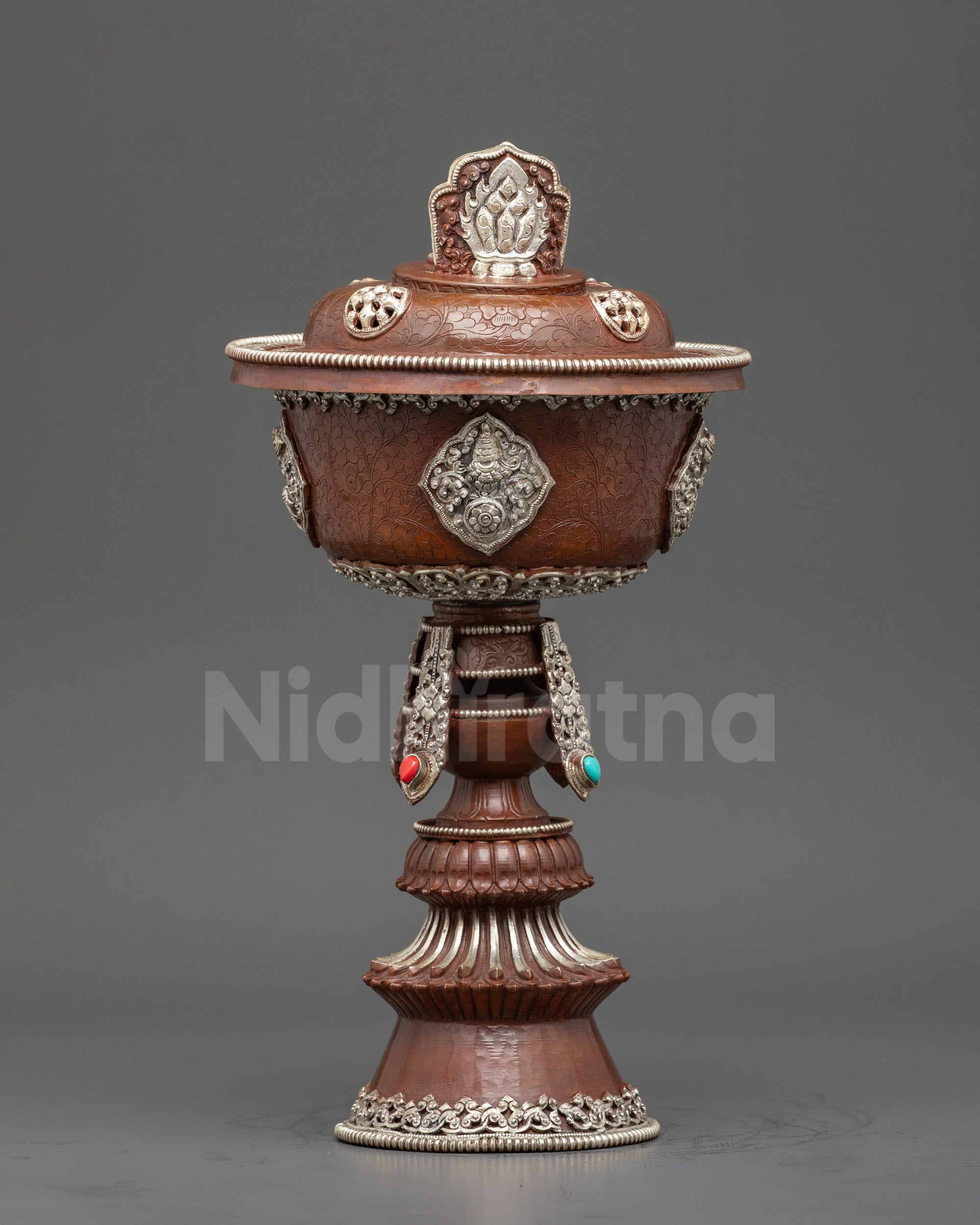 Front view Tibetan Butter Lamp, copper with silver plating and auspicious Buddhist symbols