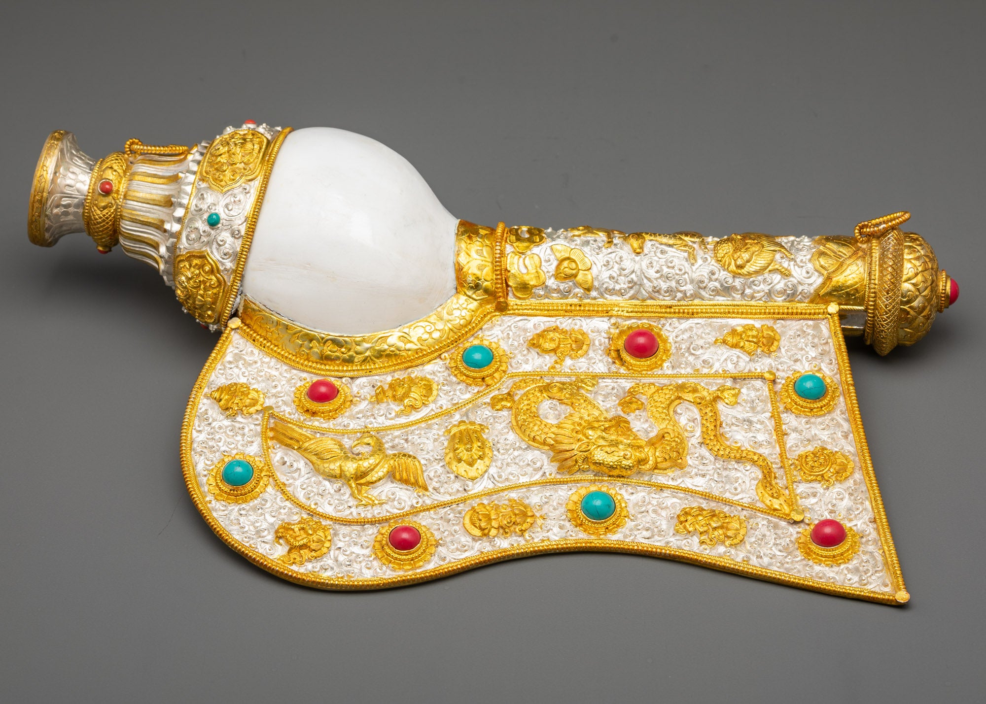 Front view Tibetan Conch Shell gold and silver-plated with coral, turquoise, mythical creatures