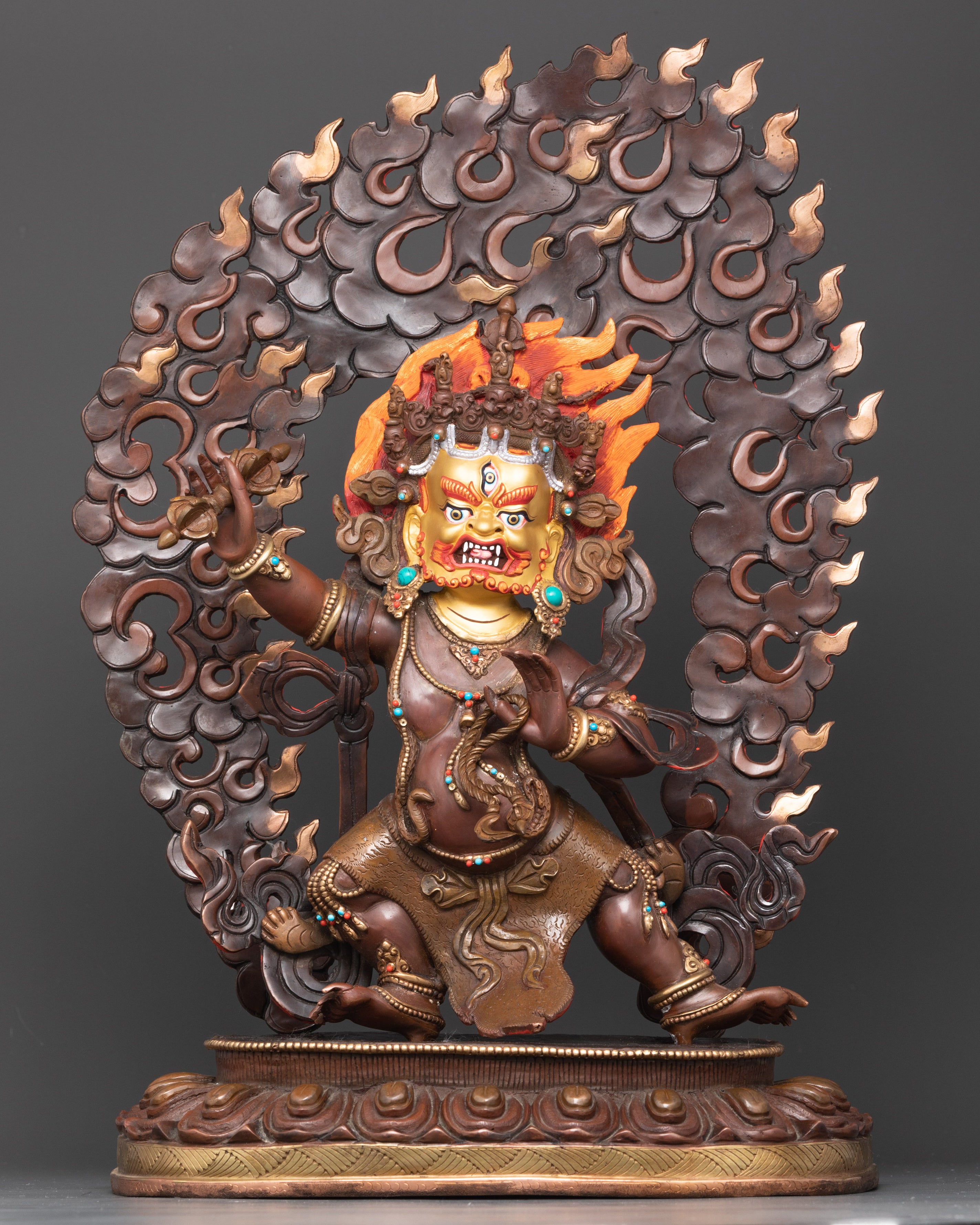 Front view Vajrapani Statue with gold-painted face, lotus pedestal, and wrathful posture