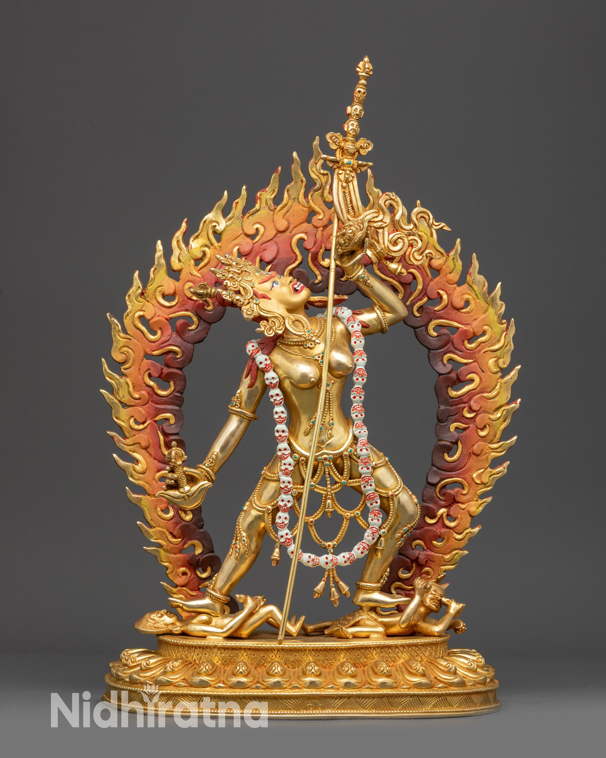 Front view Vajrayogini statue with gold fire-gilded face, five-skull crown, and lotus seat