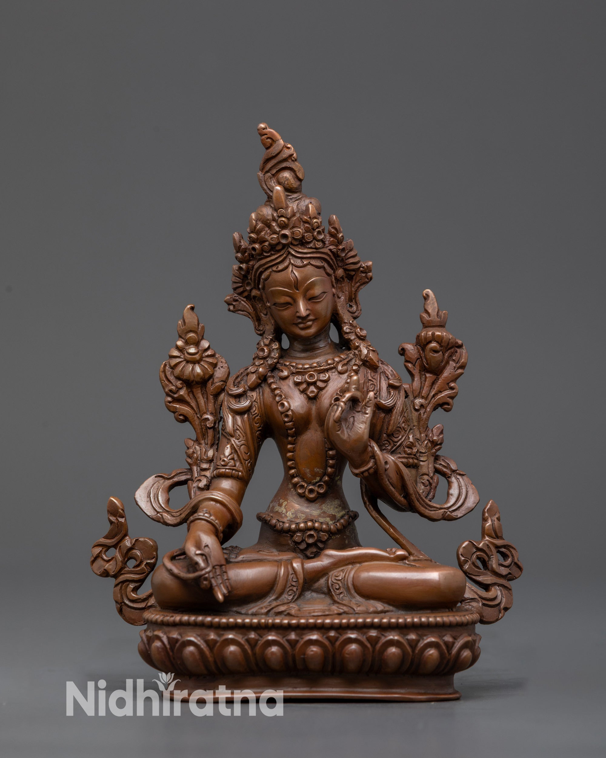 Front view White Tara seated in royal ease mudra with flowing robes and jeweled crown