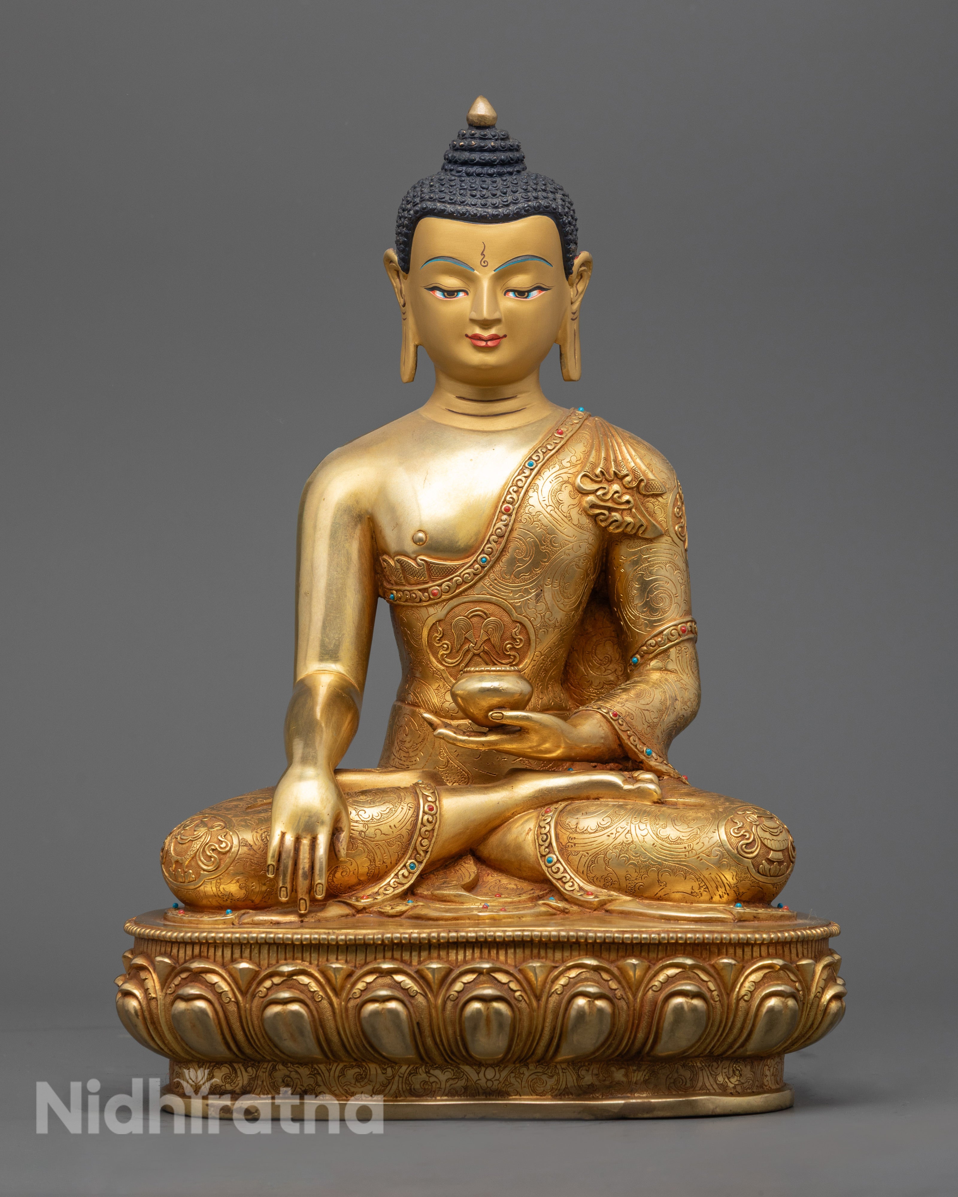 handcrafted Shakyamuni Buddha Statue seated on a lotus throne, featuring 24K gold fire gilding and intricate Nepalese carvings.