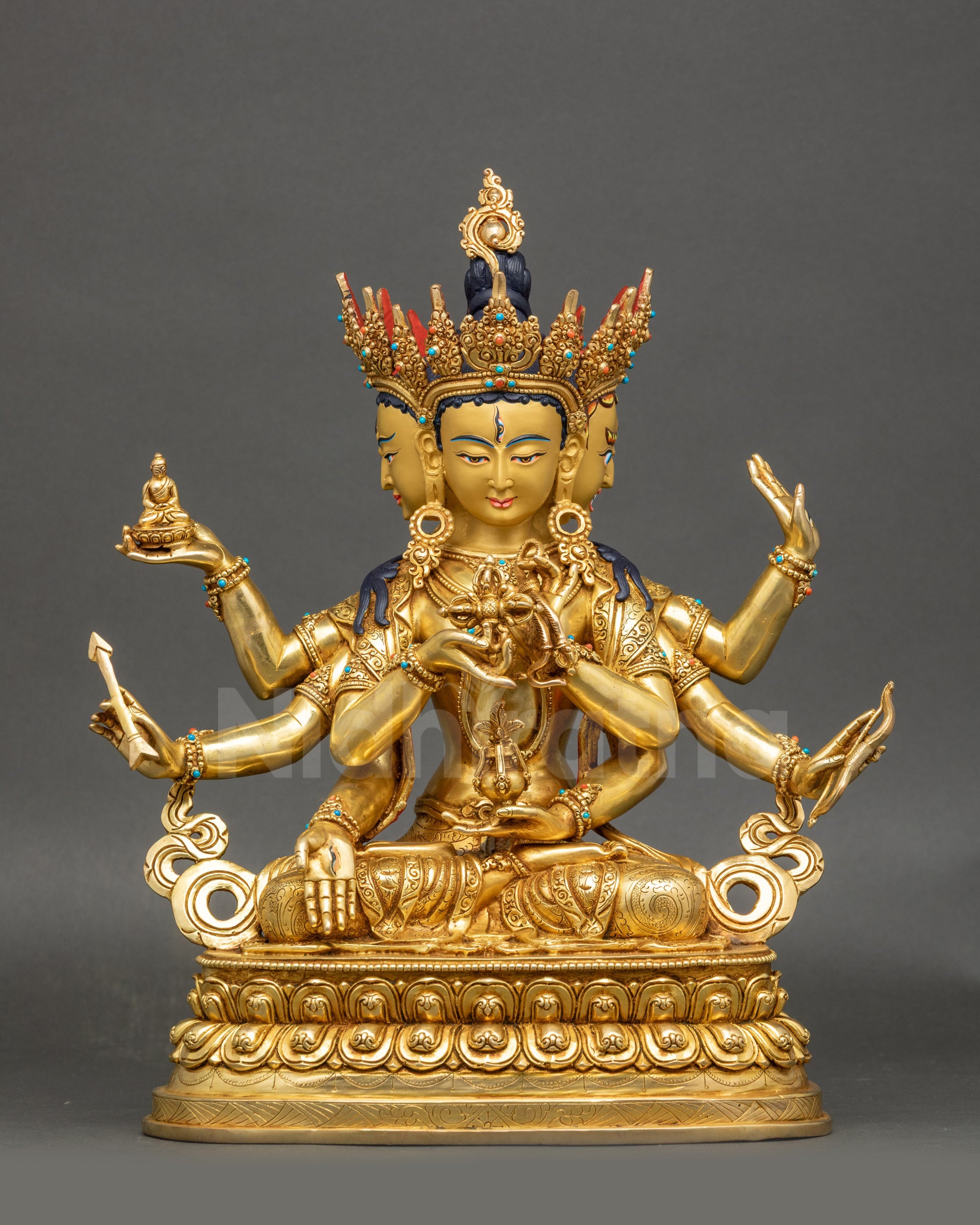 Front view of 24K gold-gilded Namgyalma statue with three faces and eight arms on lotus seat