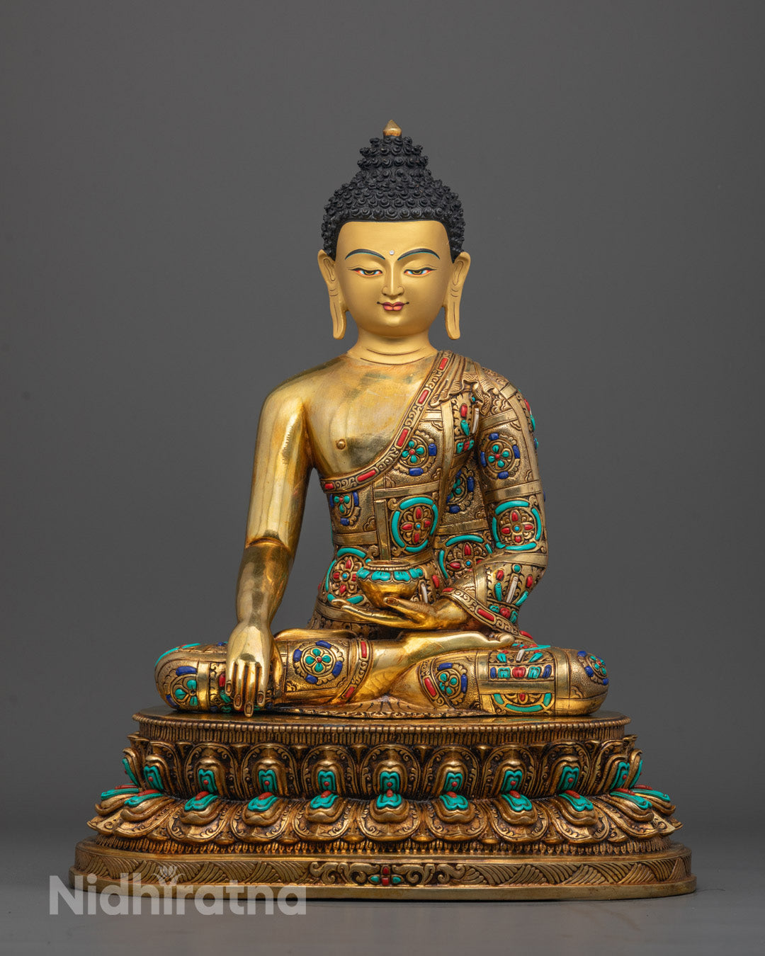 Front view of Buddha Shakyamuni Statue with gold face and turquoise coral inlays