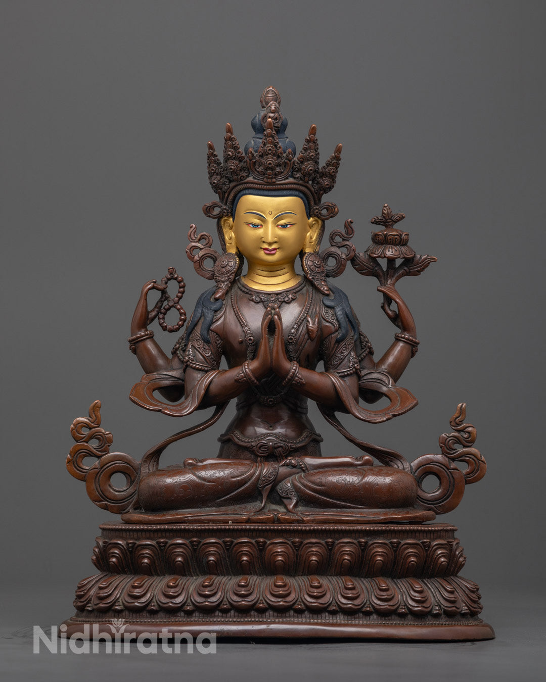 Front view of Chenrezig Bodhisattva statue hand-carved from oxidized copper