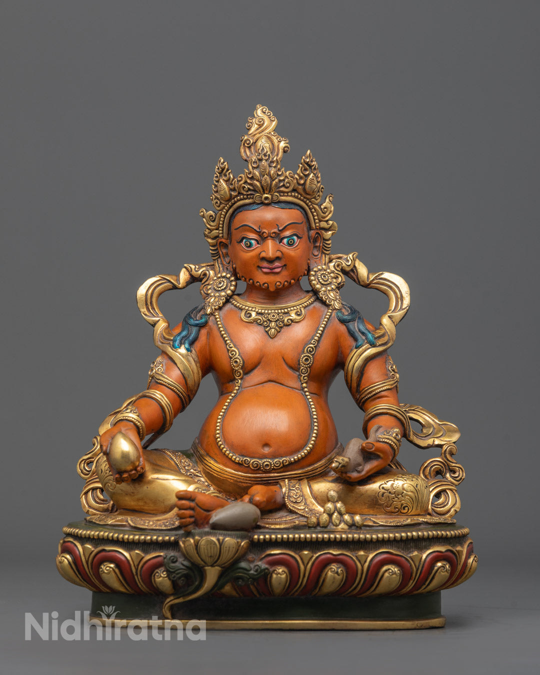 Front view of Colored Dzambhala Sculpture with gold-gilded face and vibrant acrylic paint