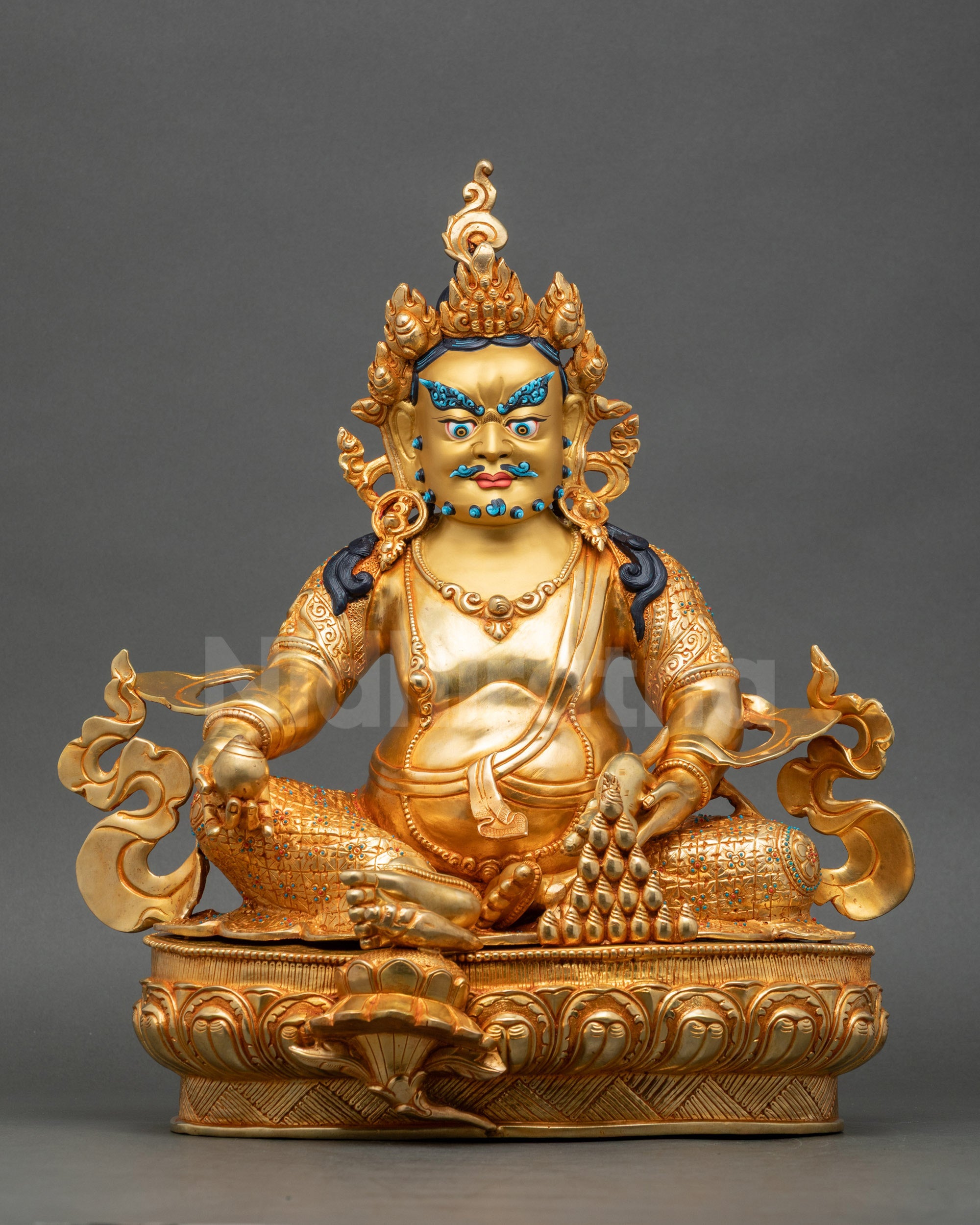 Front view of Dzambhala Statue gold-gilded copper with intricate lotus base details