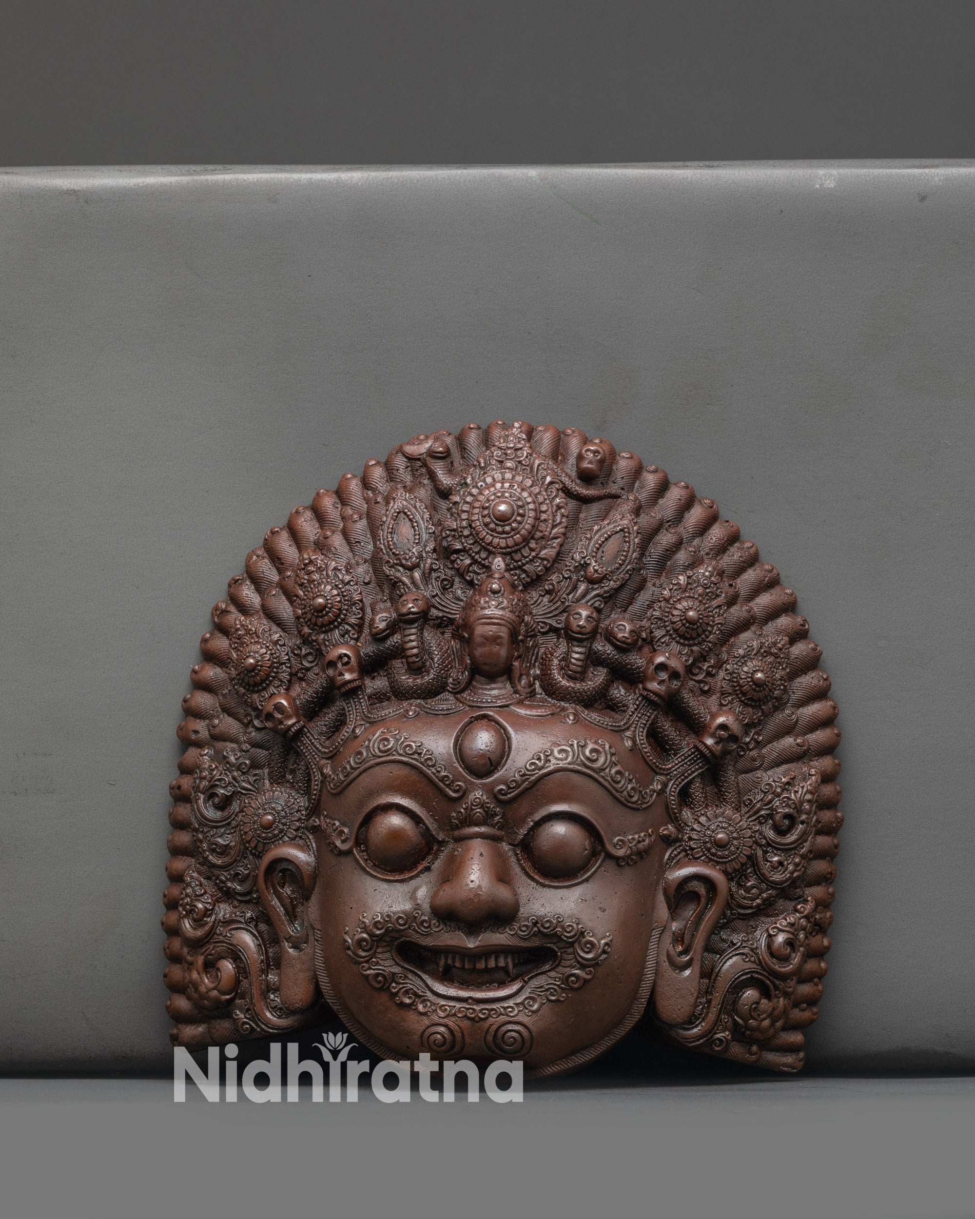 Front view of Fierce Bhairav Mask showing oxidized copper details and fierce expression