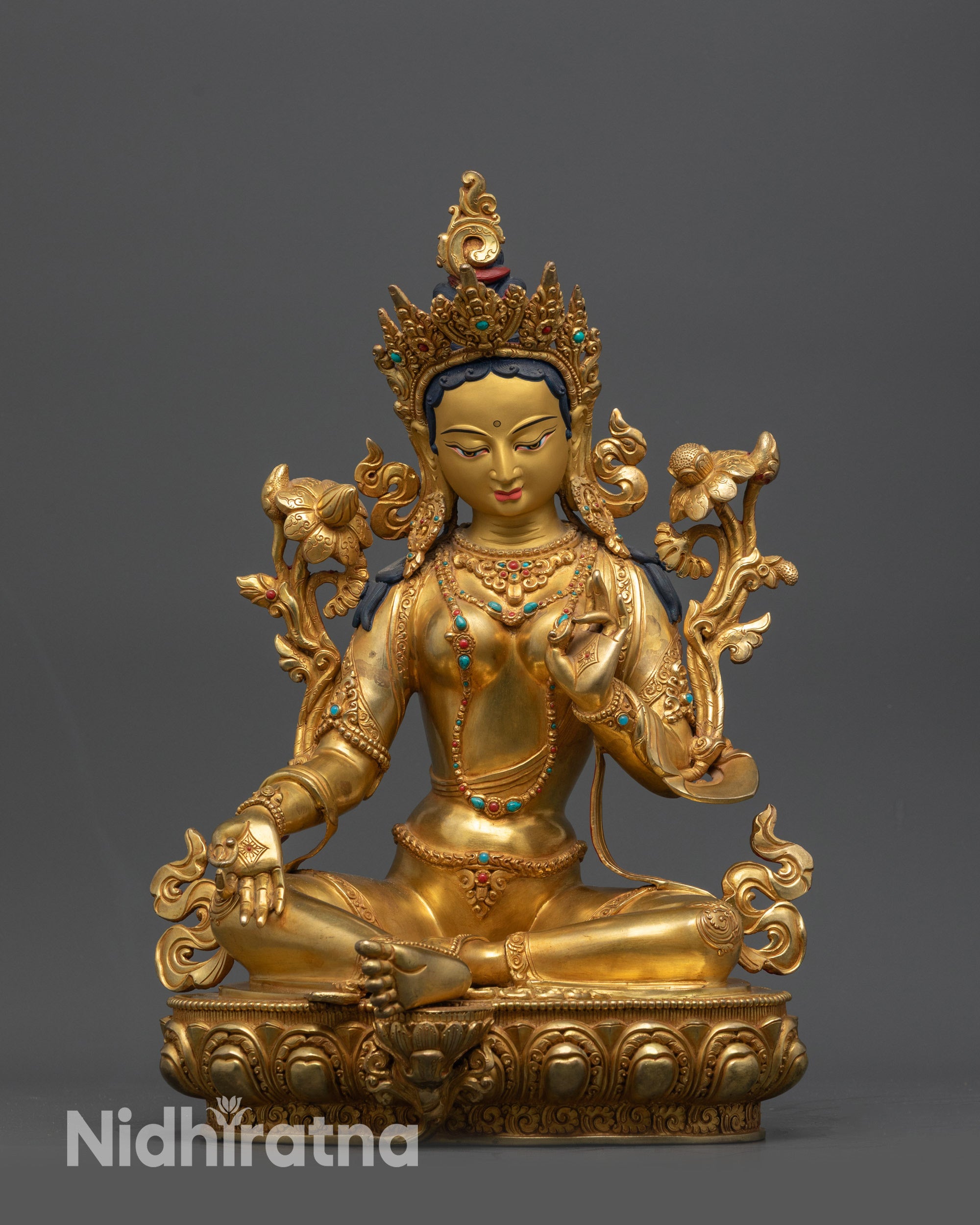 Front view of Green Tara Sculpture with lotus seat and gold-gilded face from Nepal