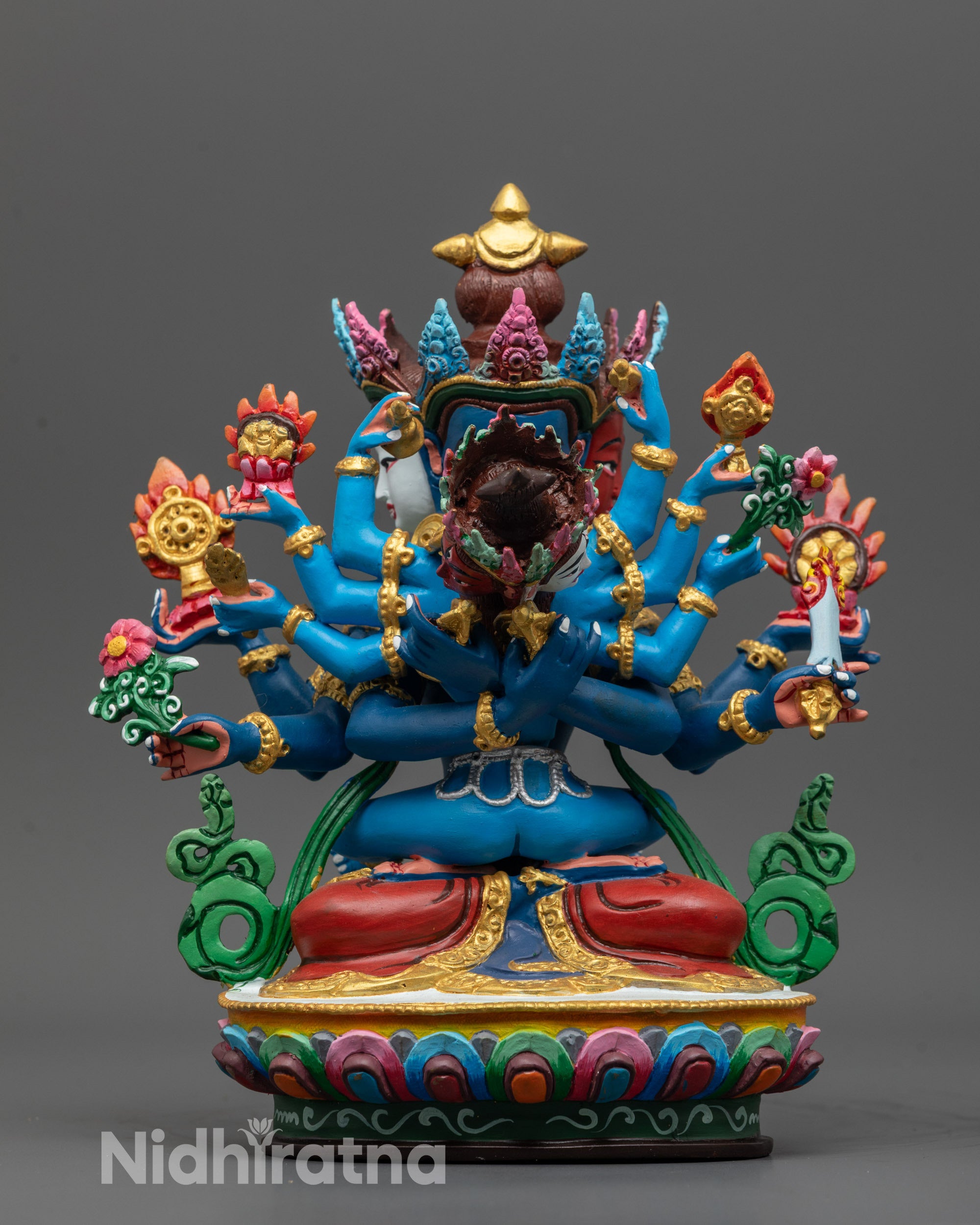 Front view of Guhyasamaja Consort Statue showing three faces and six arms in copper and colors