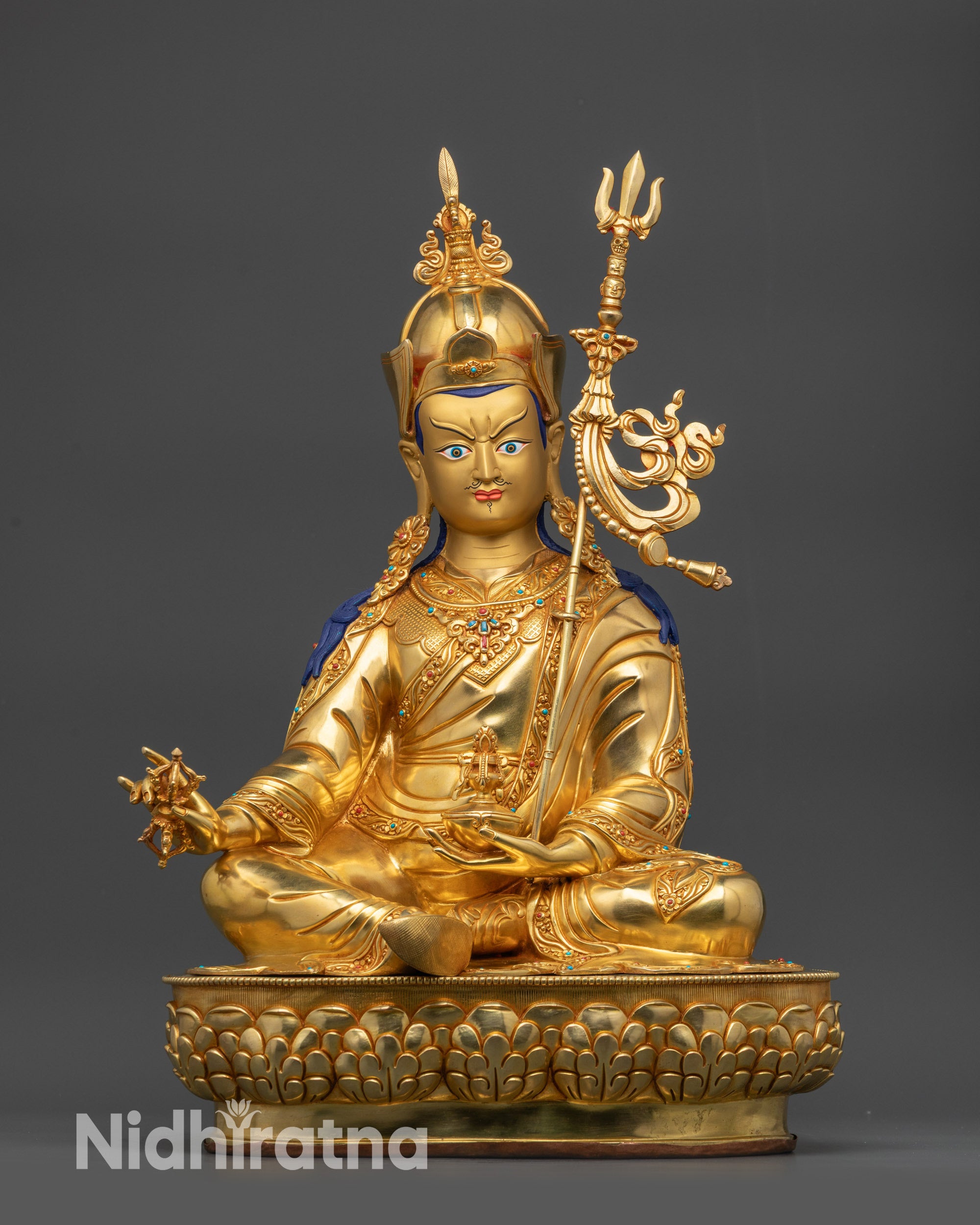 Front view of Guru Rinpoche statue on gold-gilded base with lotus throne