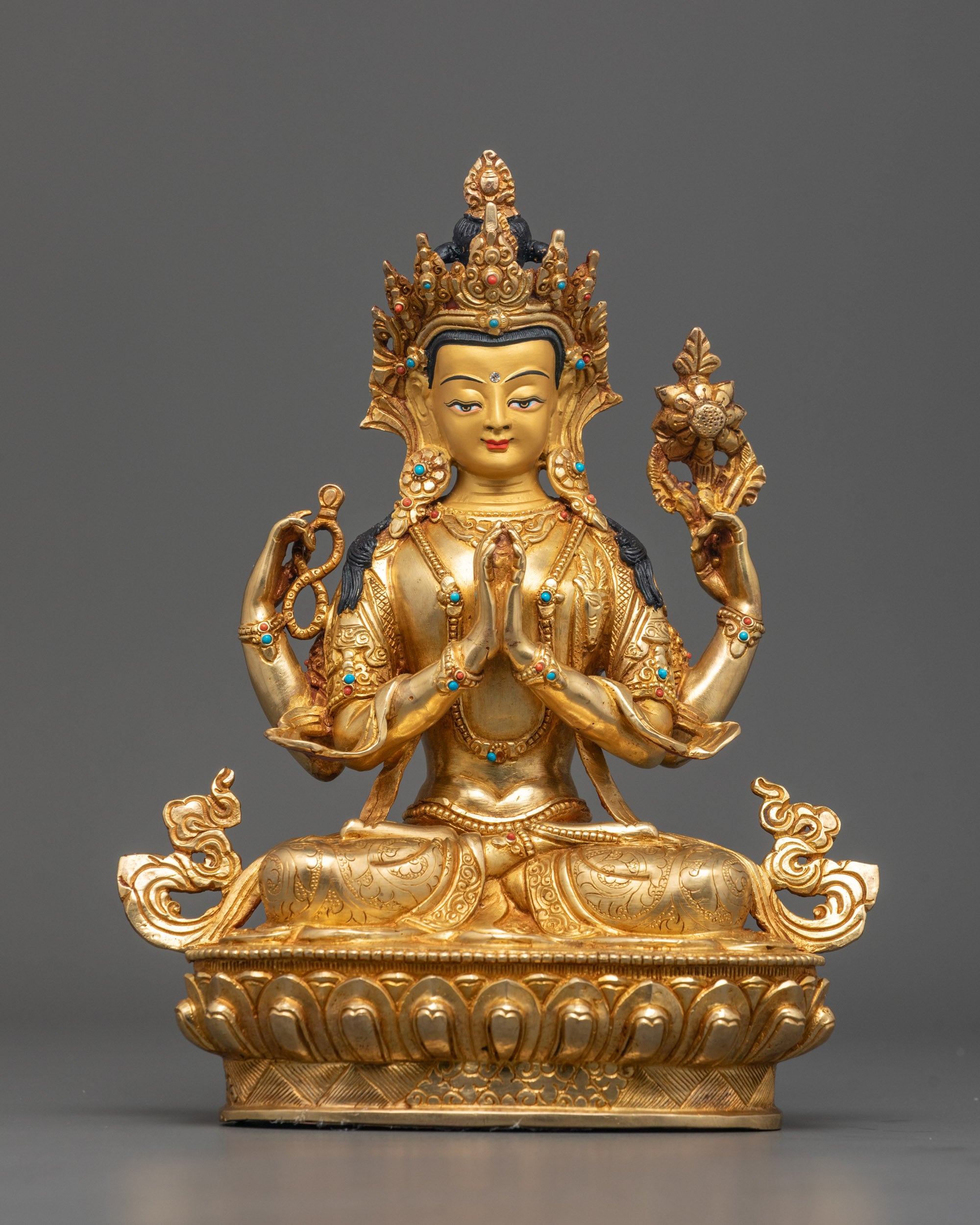 Front view of Handcrafted Chenrezig Statue with gold-gilded face and gemstone crown