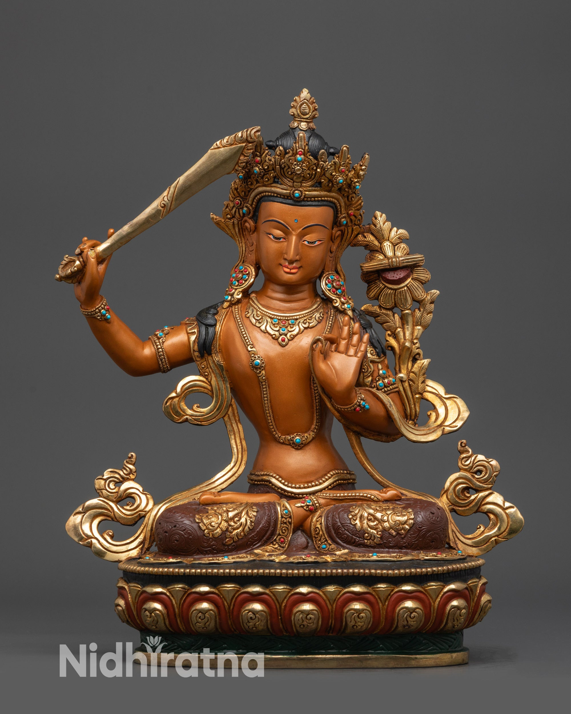 Front view of Manjushri Bodhisattva statue in meditative posture on gold lotus seat