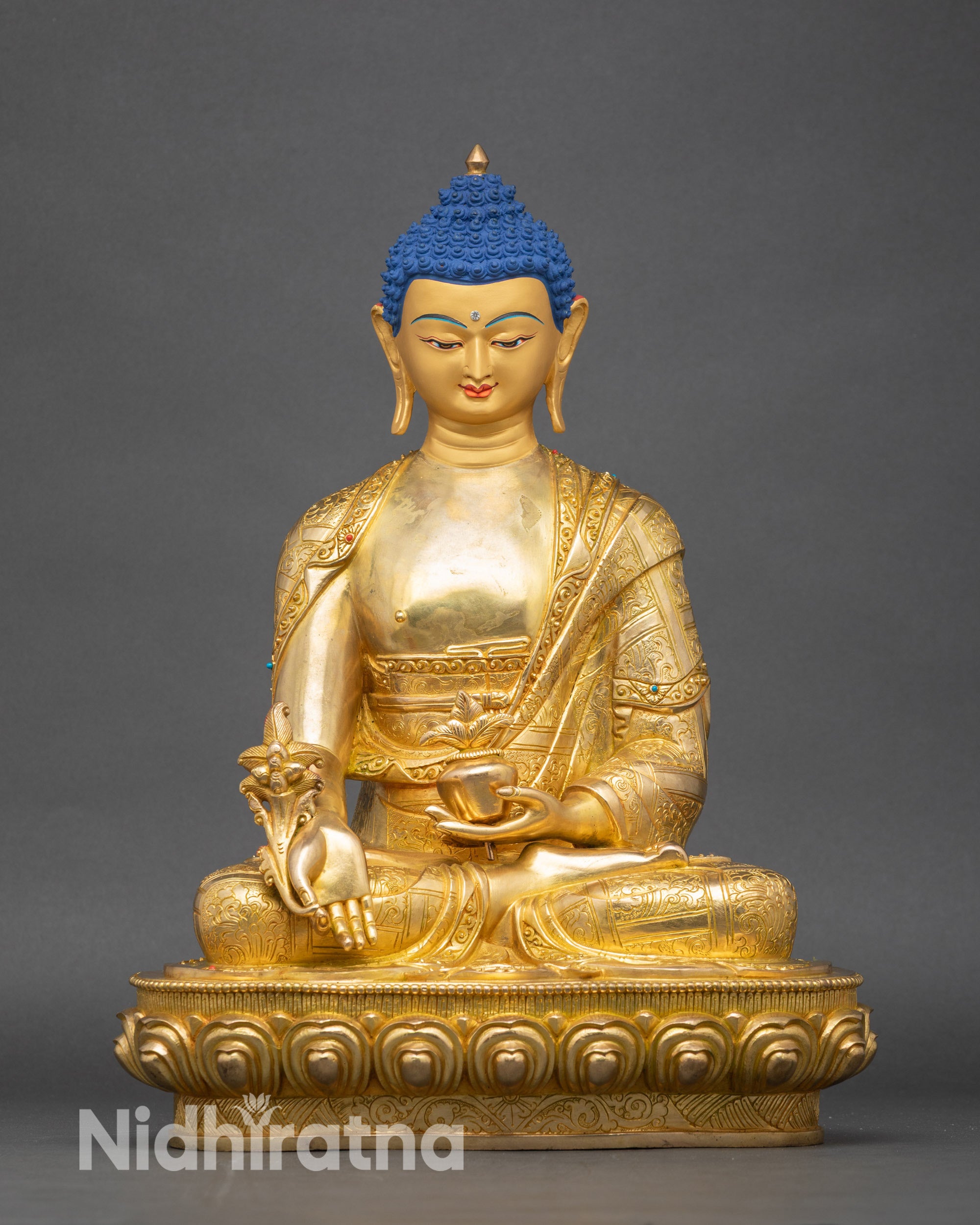 Front view of Medicine Buddha statue, handcrafted copper with gold fire-gilding