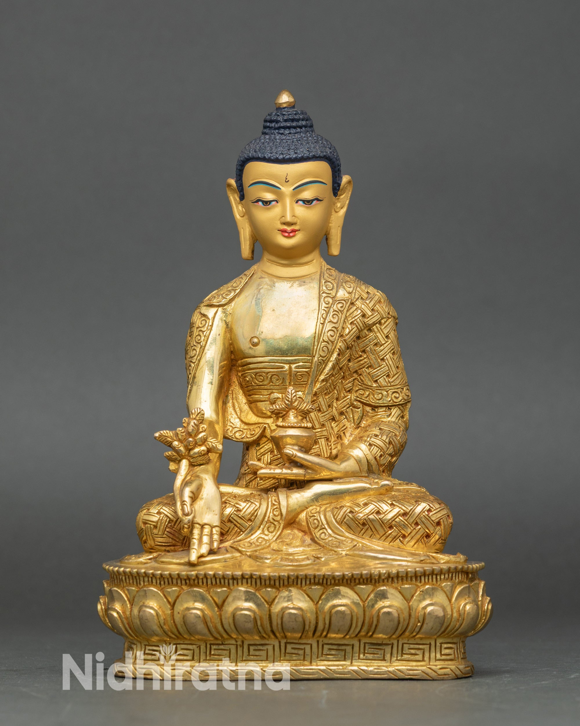 Front view of Medicine Buddha statue, handcrafted copper with gold fire-gilding