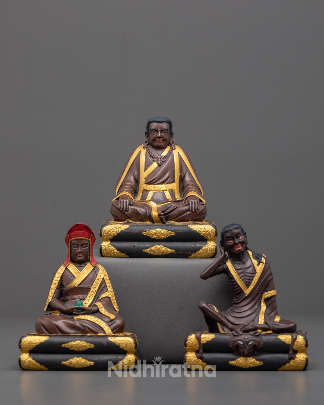 Front view of Milarepa, Marpha & Gampopa statues with gold plating and oxidized finish