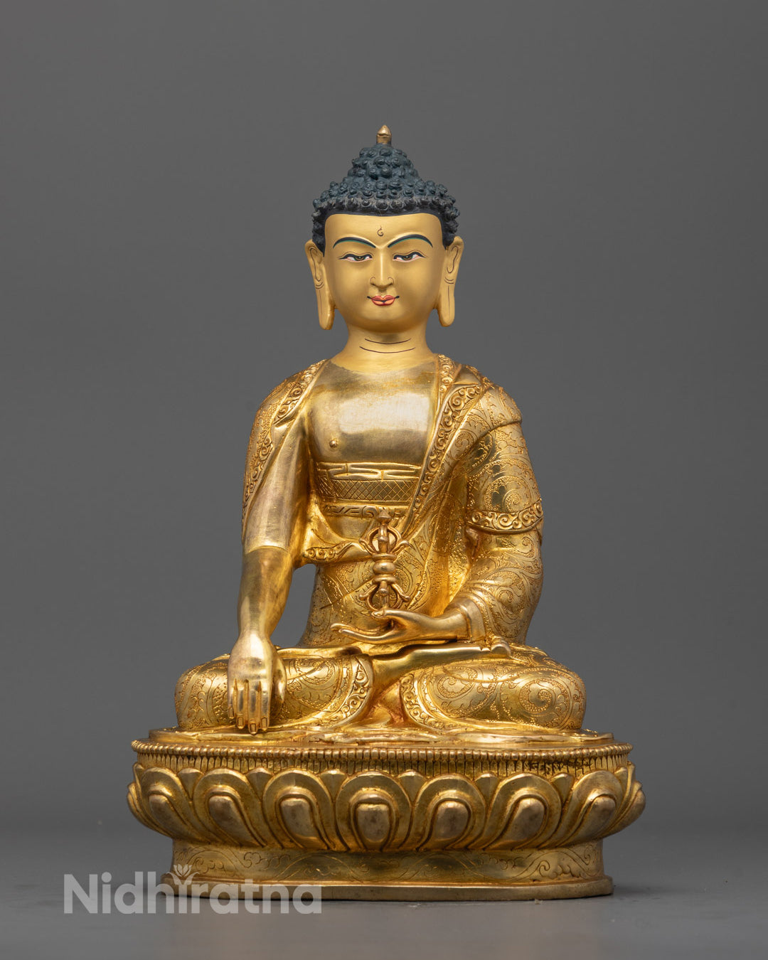 Front view of Mitrugpa Buddha Statue hand-carved in copper