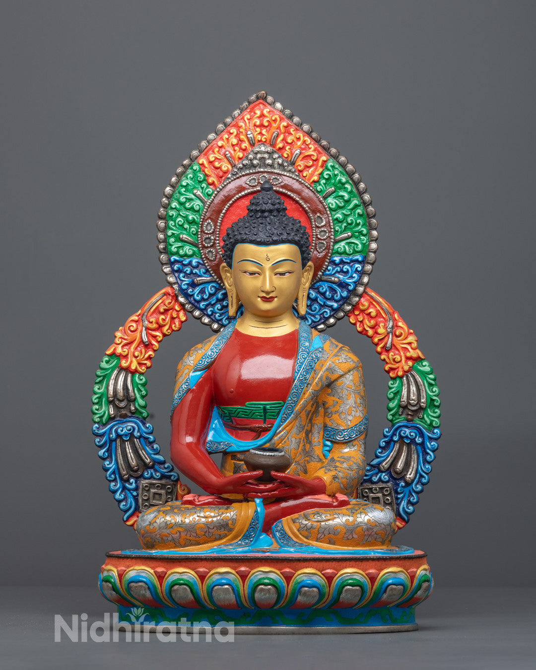 Front view of Nepalese Phowa Buddha statue with 24k gold face and vibrant acrylic colors