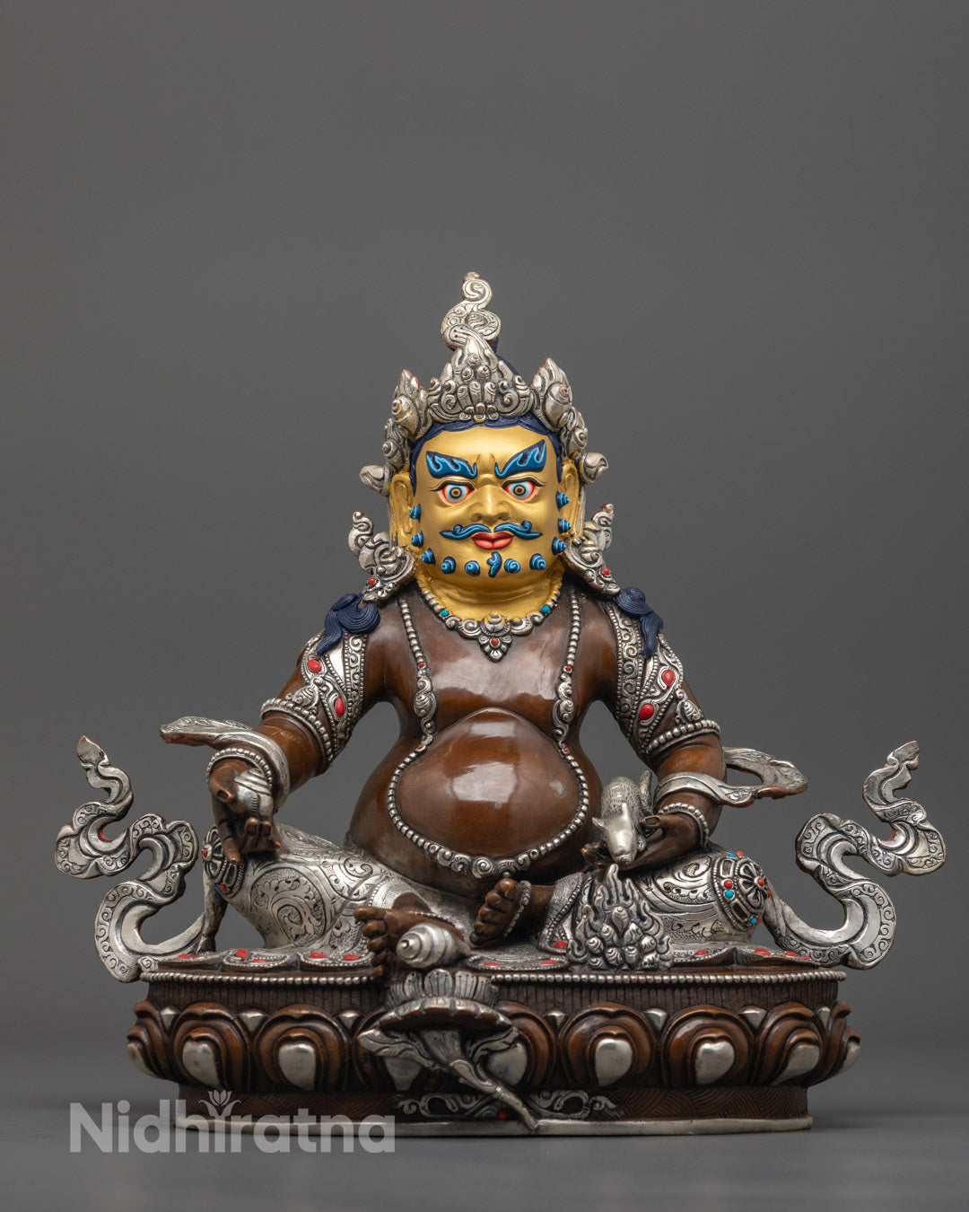 Front view of Oxidized Dzambhala Statue with gold-gilded face and silver-plated oxidized copper body