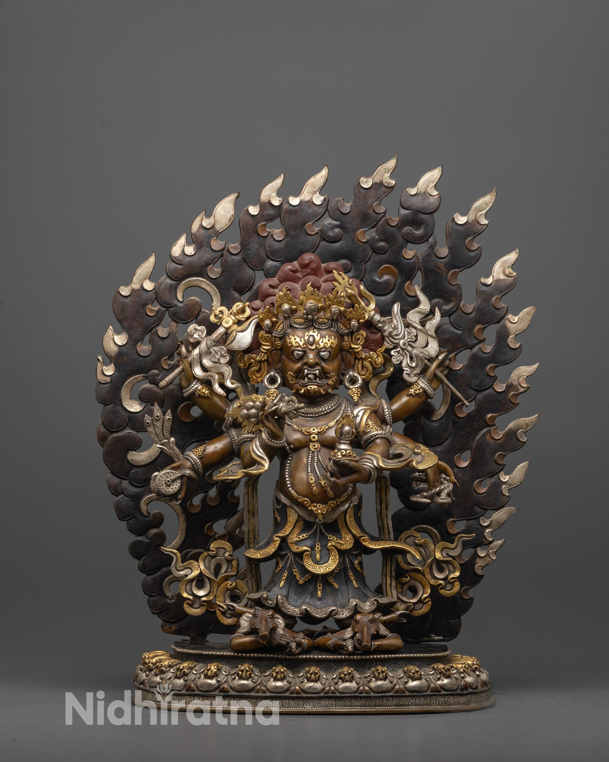 Front view of Oxidized White Mahakala Statue with silver and gold crown and vajra and bell