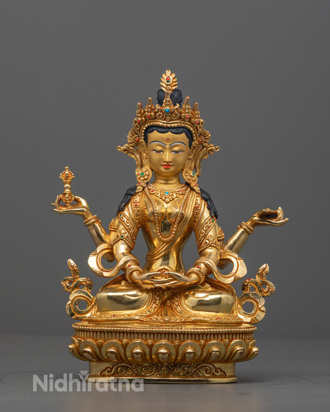 Front view of Praja Paramita statue with 24K gold-gilded face and intricate carvings
