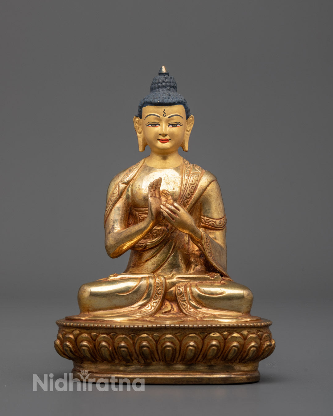 Front view of Sacred Vairocana Buddha Sculpture with gold-gilded face and detailed carvings