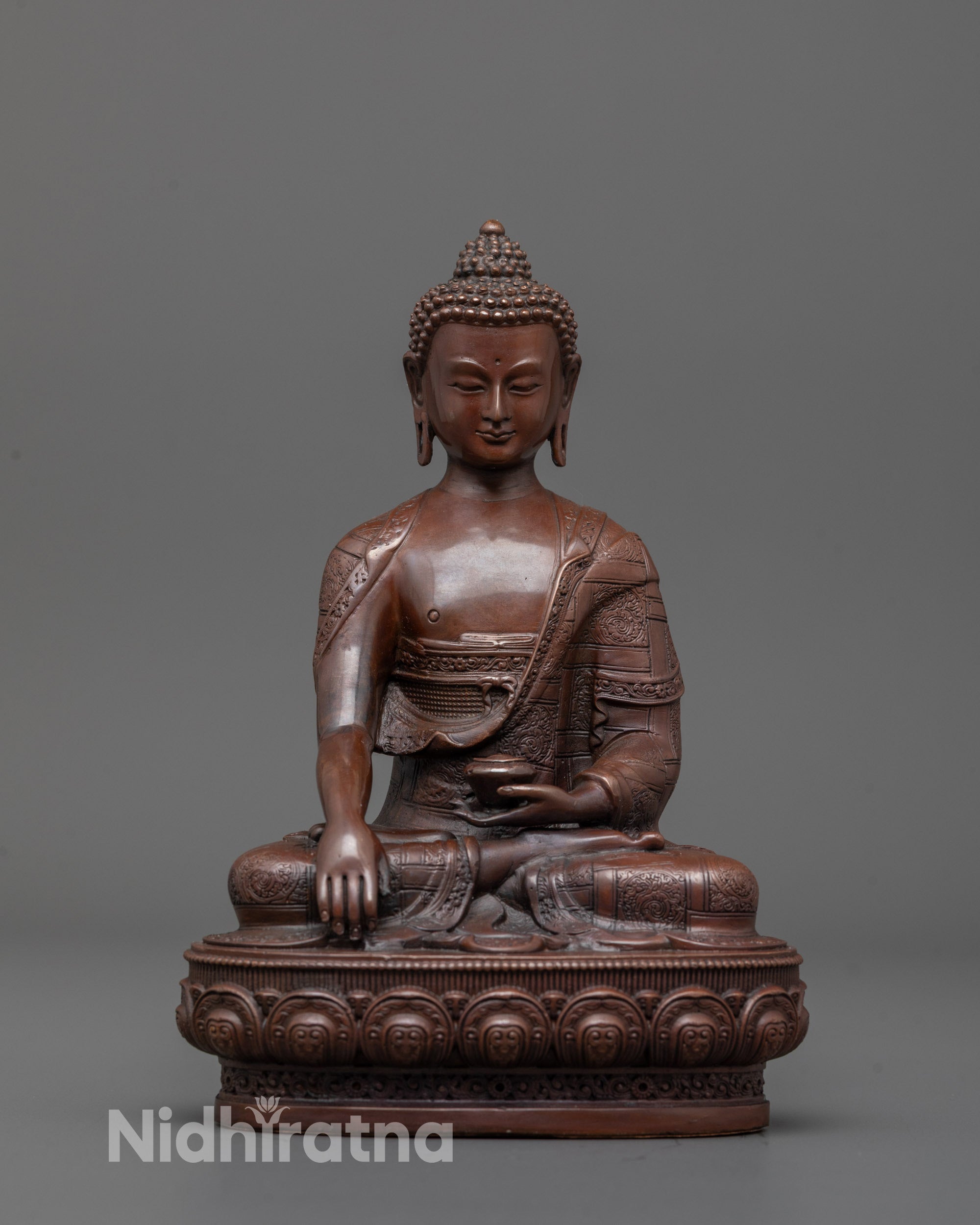 Front view of Shakyamuni Buddha Statue seated on a lotus base with peaceful expression