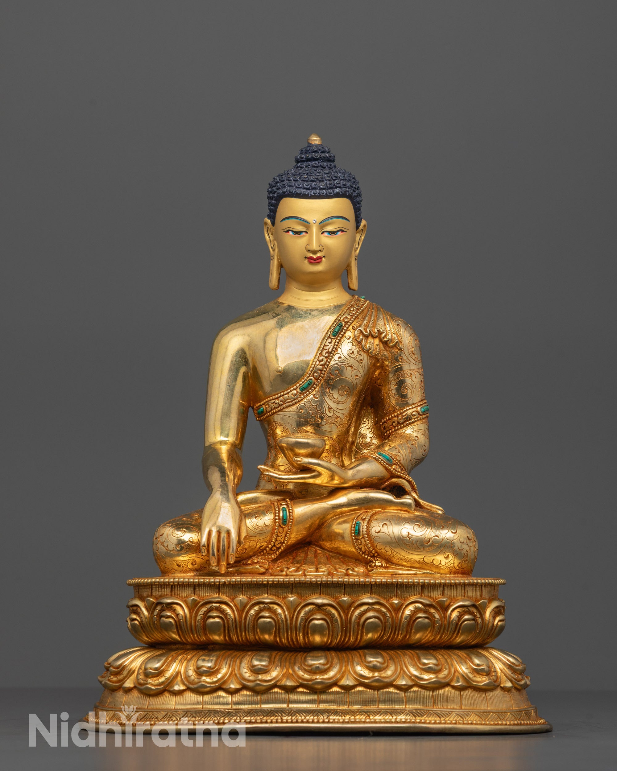 Front view of Shakyamuni Buddha Statue seated on lotus base with serene expression