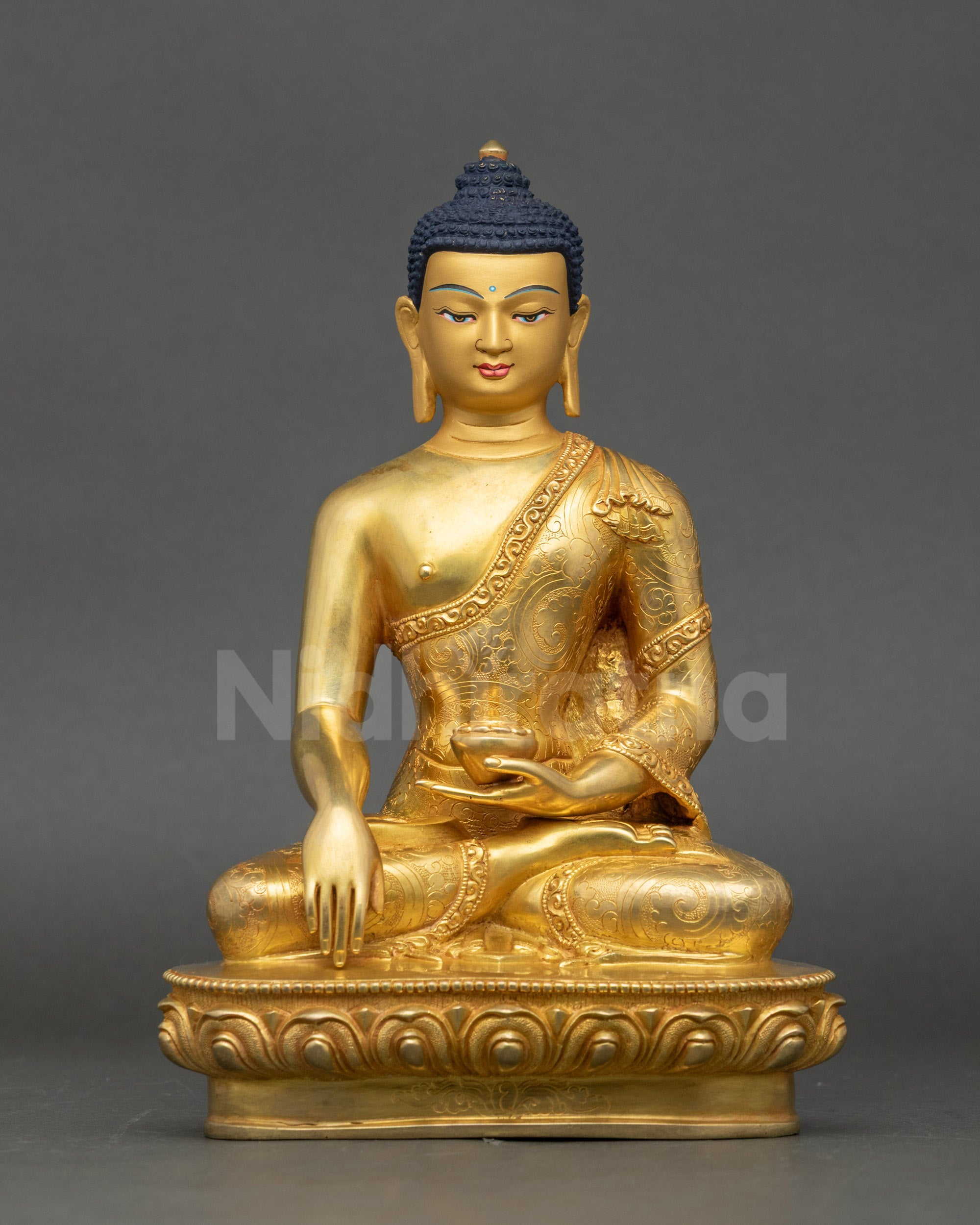 Front view of Shakyamuni Buddha statue, gold fire-gilded copper with lotus seat