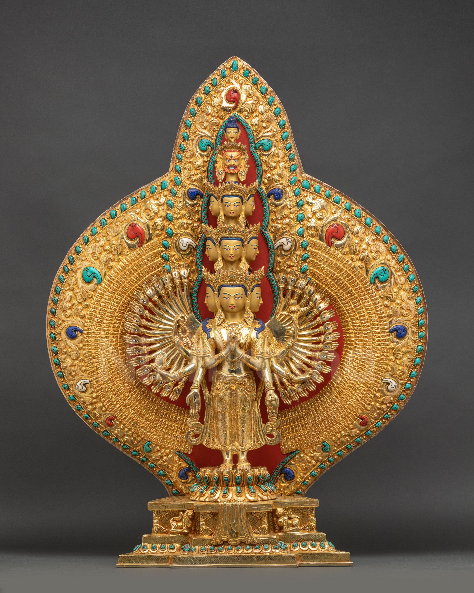 Front view of Thousand-Arm Chenrezig statue with gold fire-gilding on copper and lotus throne