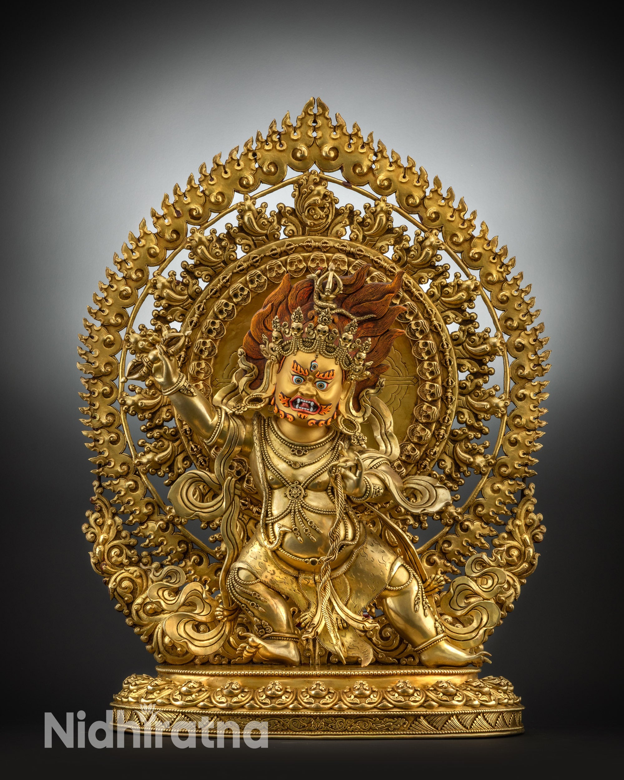 Front view of Vajrapani statue holding Dorje and lasso on lotus base
