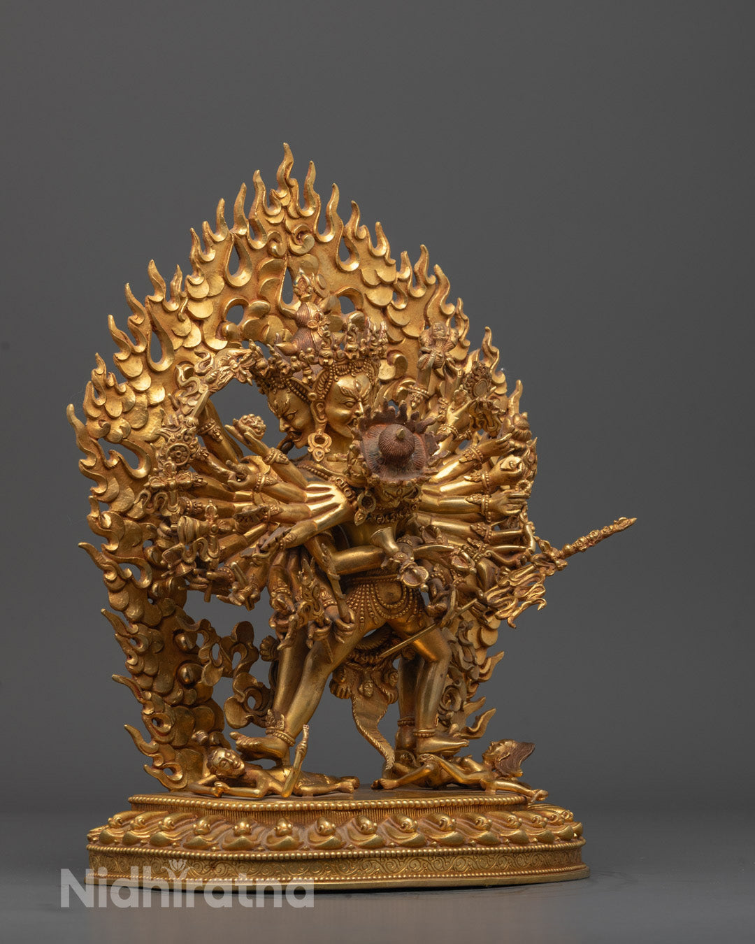 Front view of a traditional Kalachakra statue showcasing vibrant gold plating